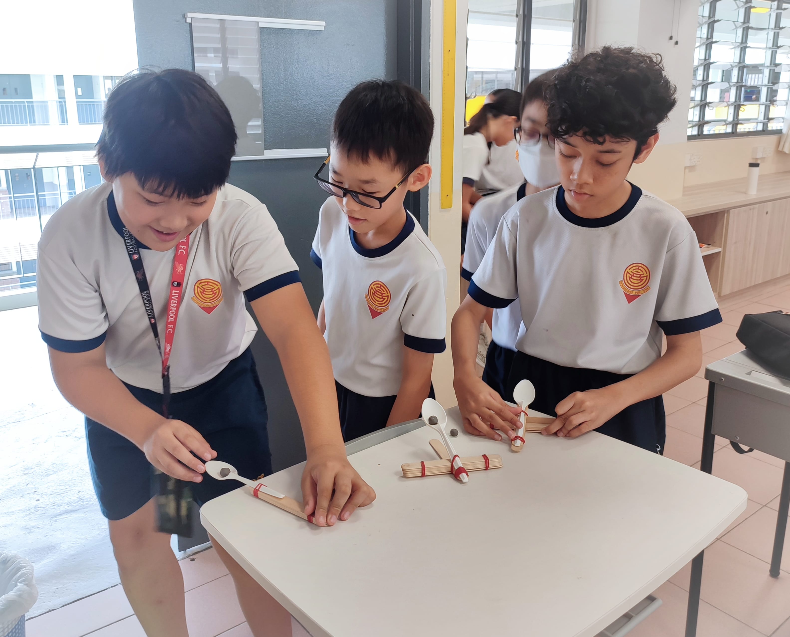 Students testing out catapults