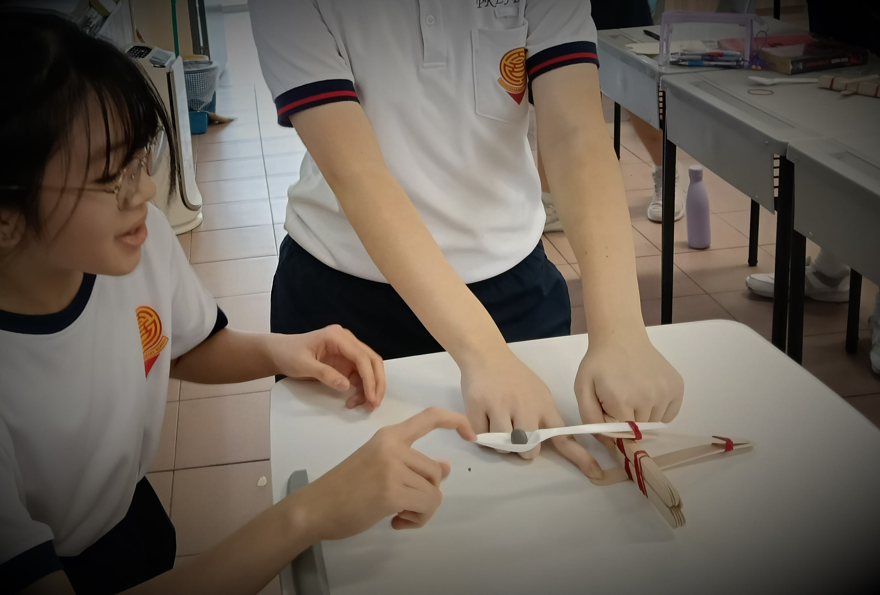 Students use household items to construct catapults