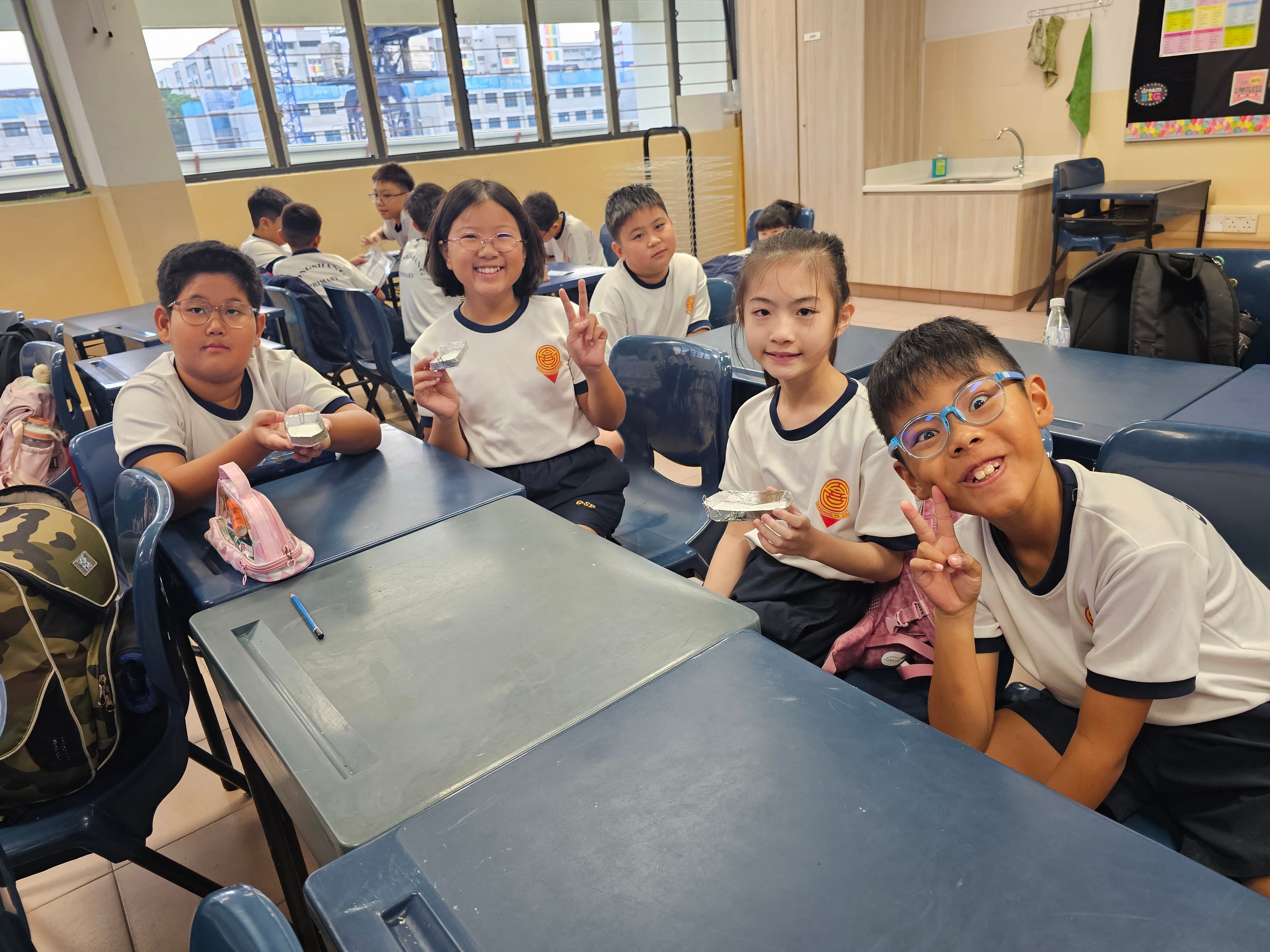 Students showing off their model hulls