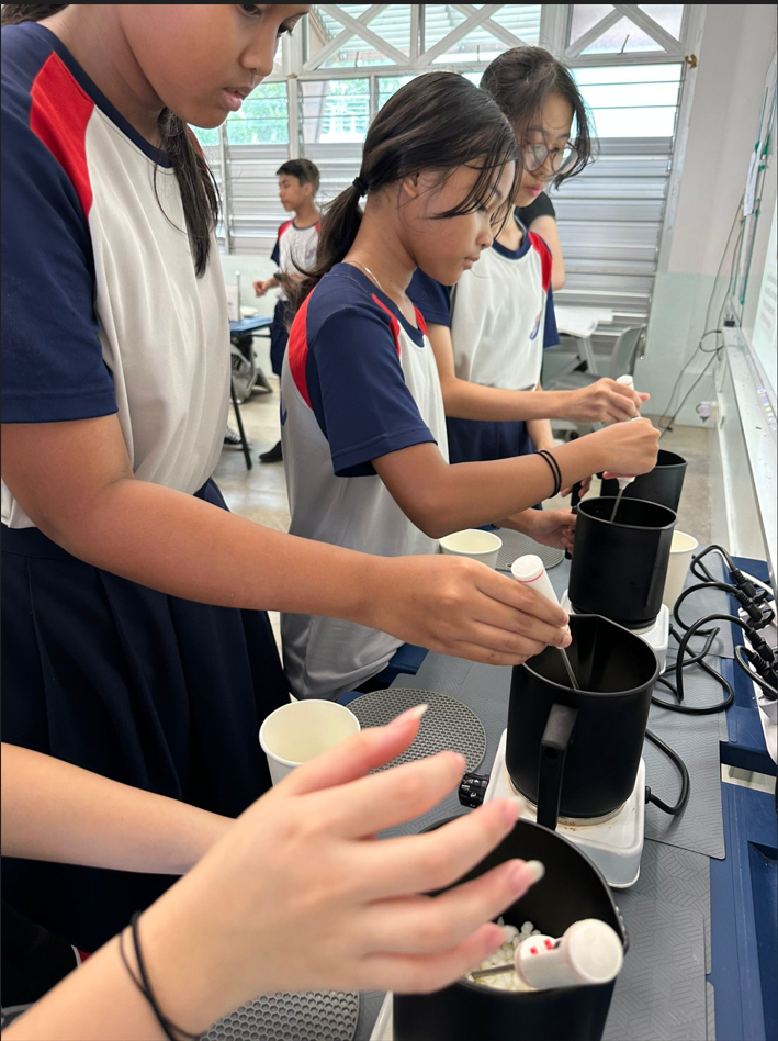 3 students learning to make coffee
