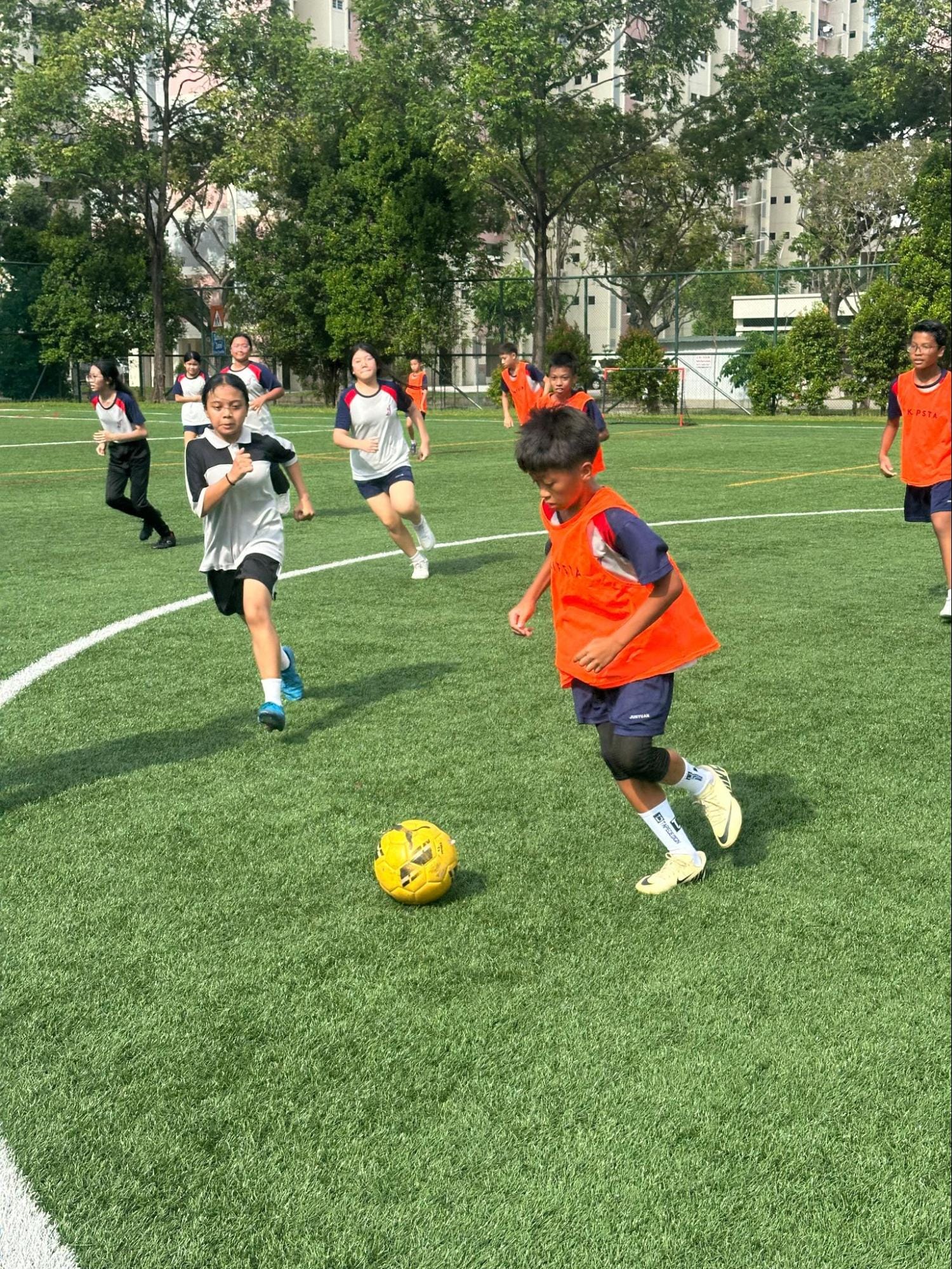A group of students playing soccer