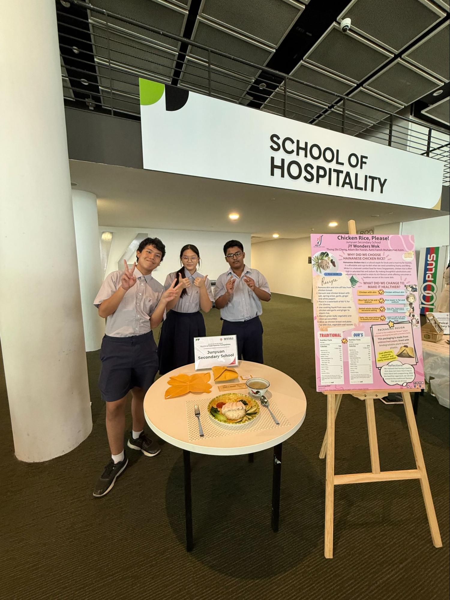 3 students displaying their food for the competition