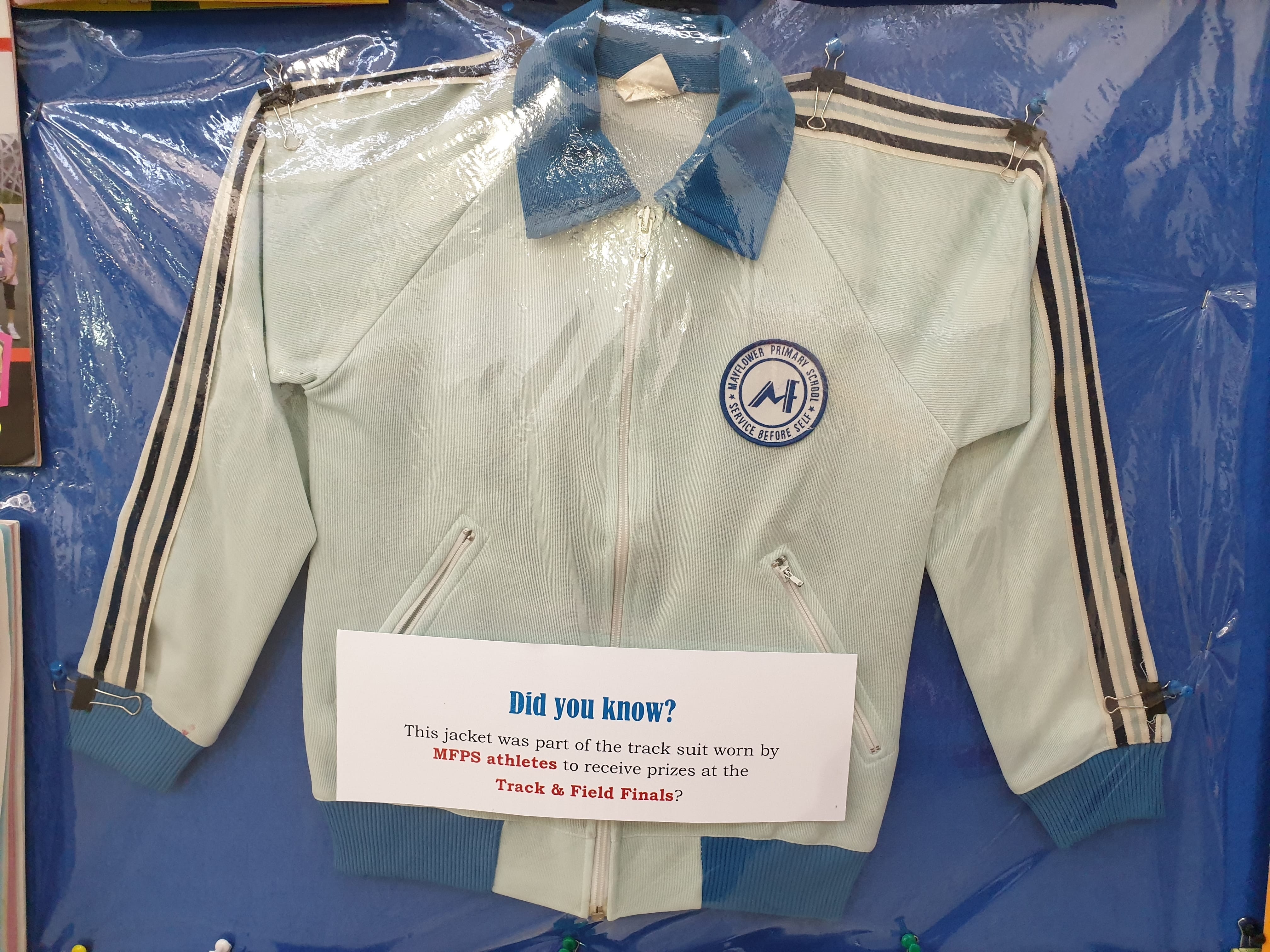 Mint-green MFPS track jacket display.