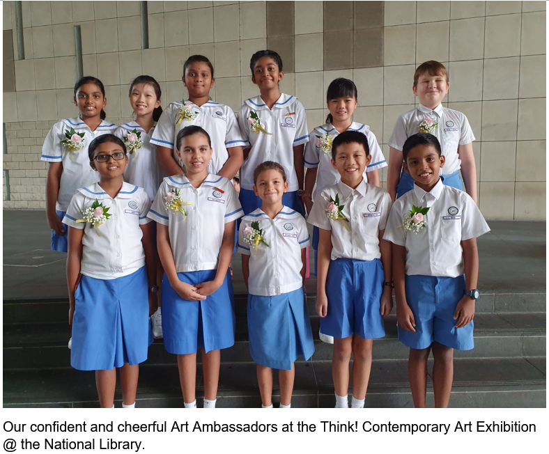 Ten children in white and blue school uniforms with flower corsages pose in two rows on steps.
