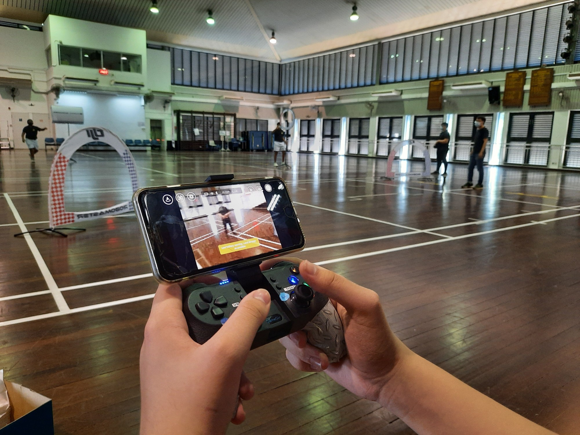 NCC club members flying a drone with their phones!