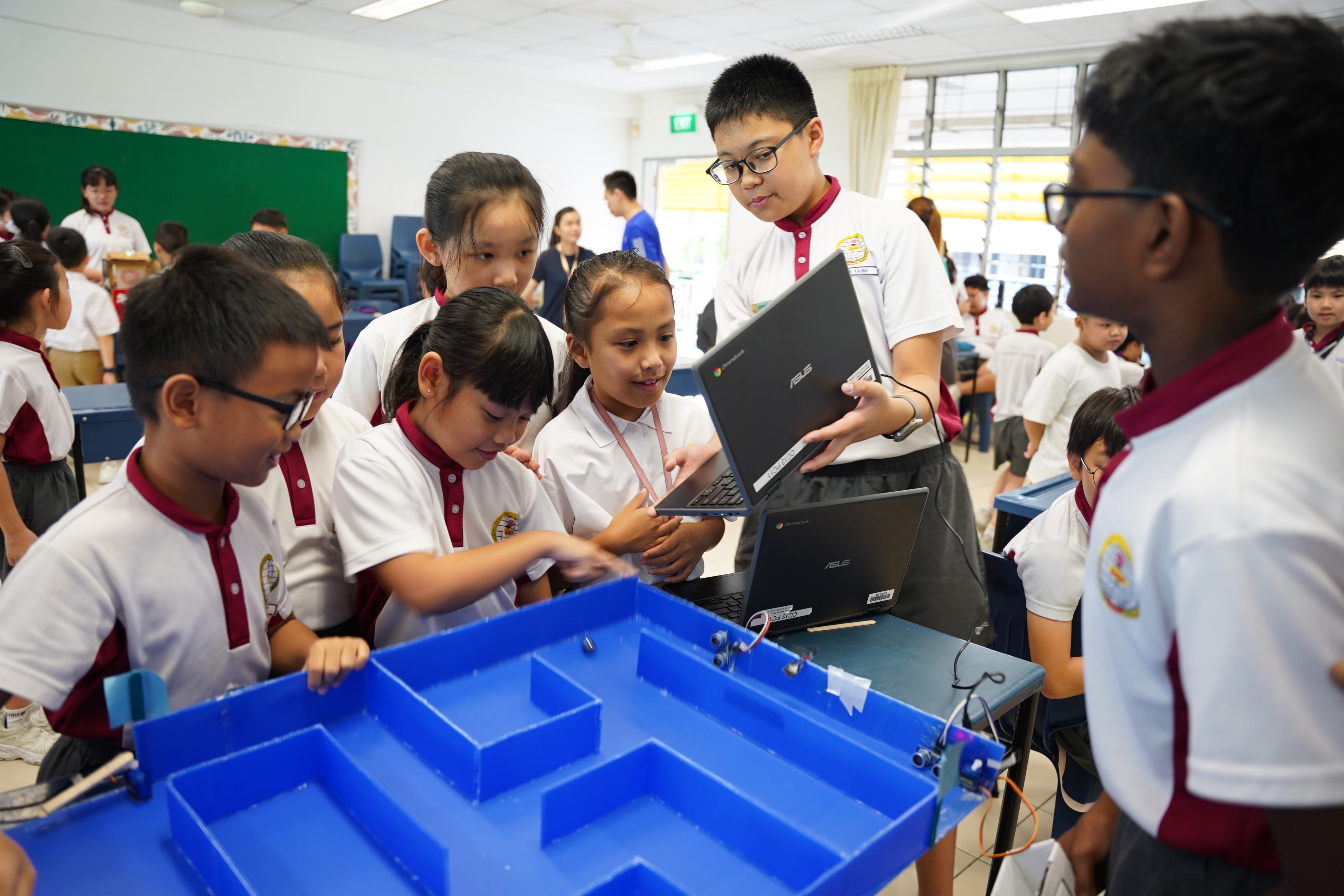 P5 students introducing their Microbit project to the lower primary students