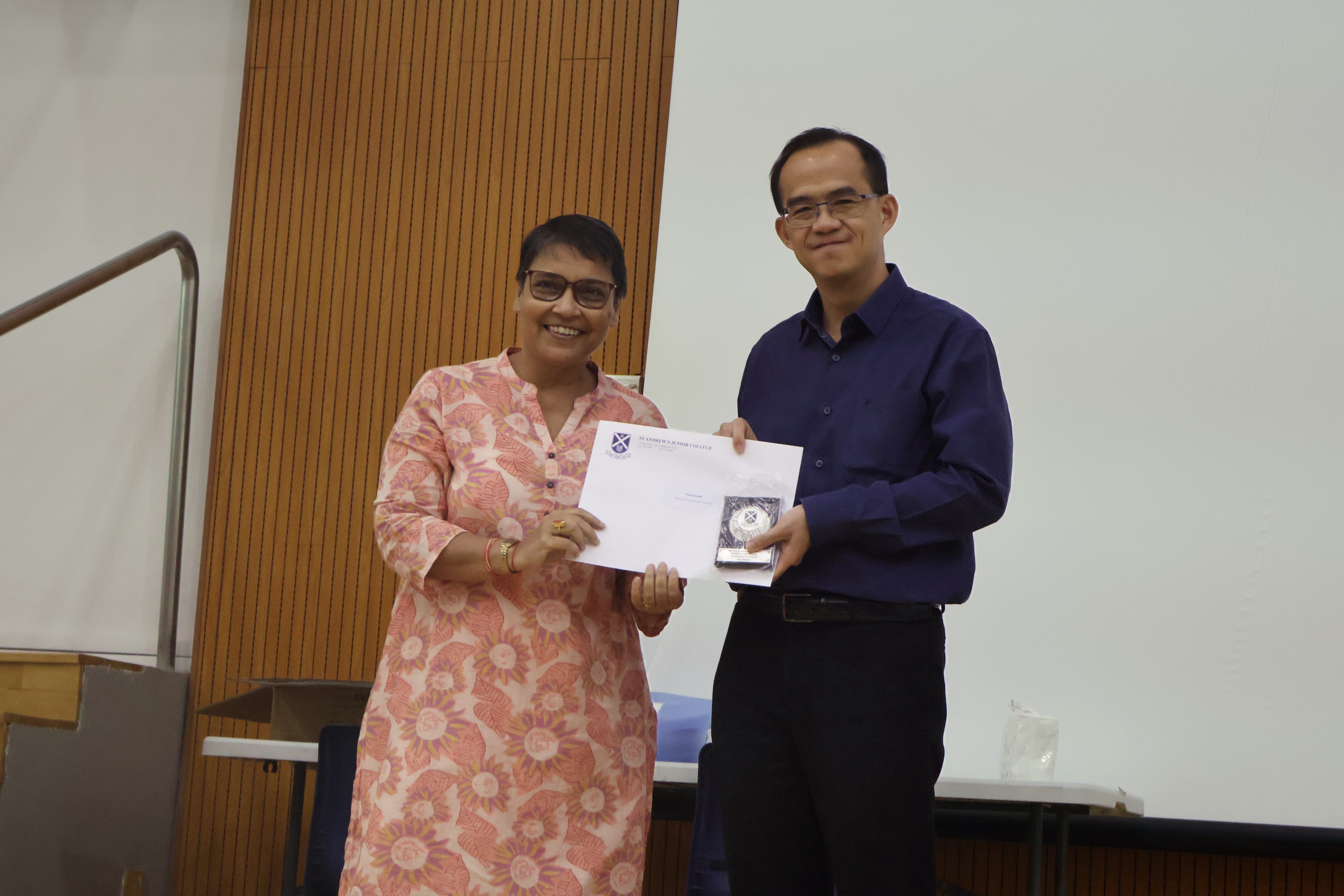 Ms Somali Paul receiving her award from Principal of SAJC, Mr Tham Kine Thong