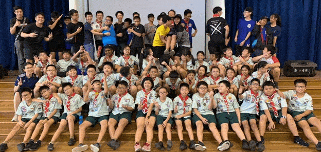 Groups photos of scouts in uniforms engage in camp activities; as well as Learning Journeys to: Fire Station, RSAF 55 Exhibition, and Rainforest Wild Asia.