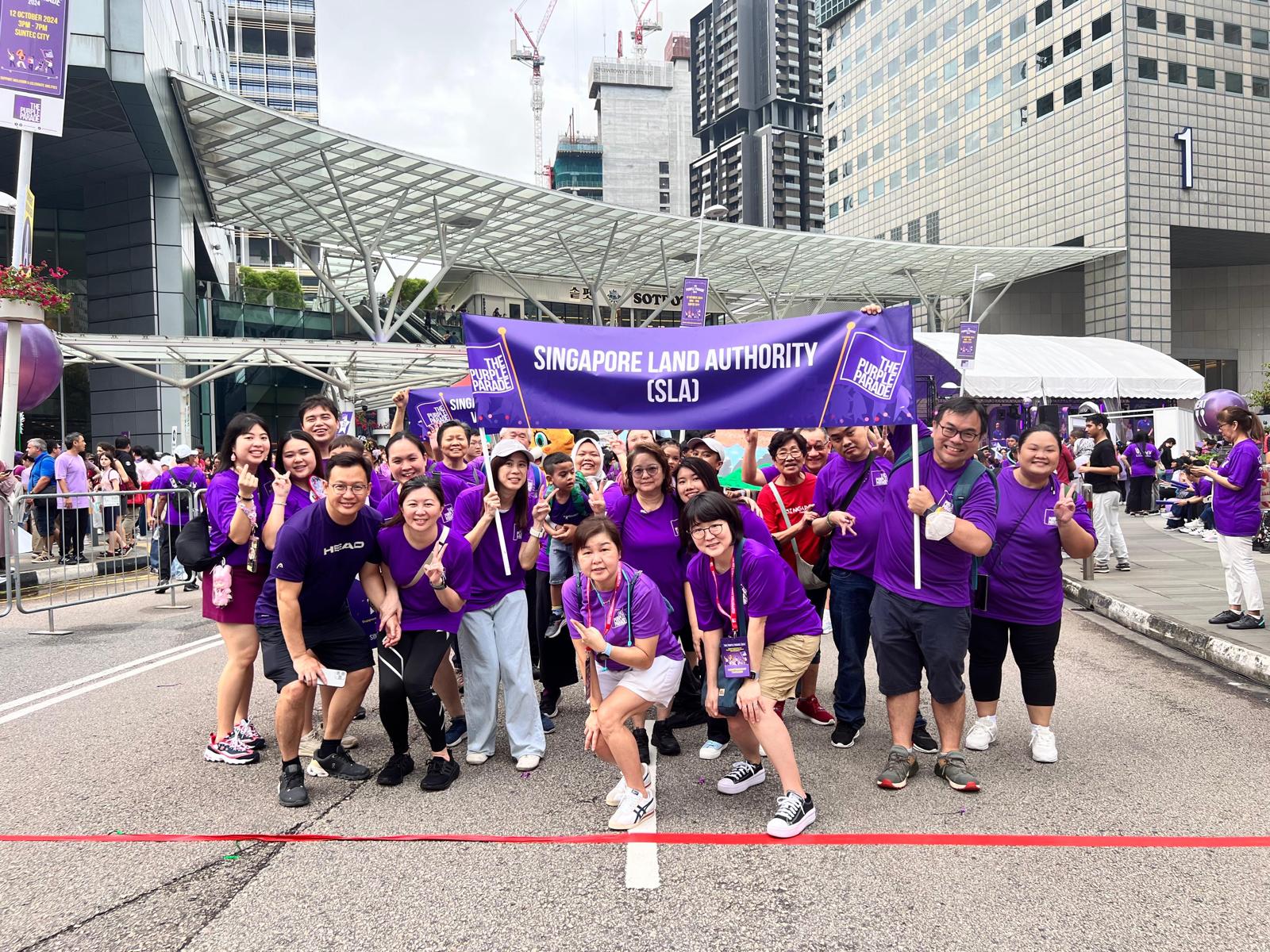 A group of SLA staff at the starting point of The Purple Parade