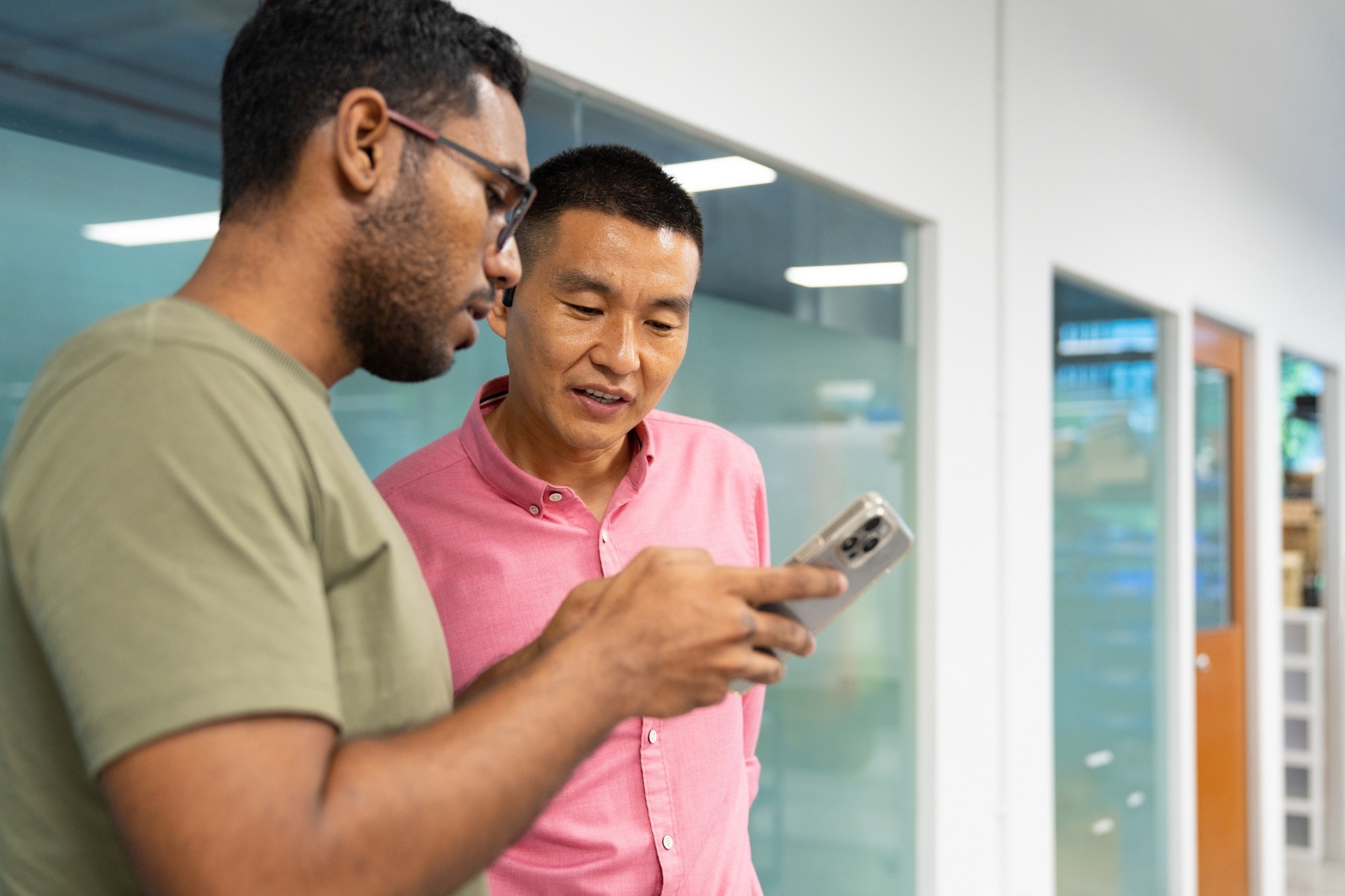 Dr Zhang talking to his colleagues