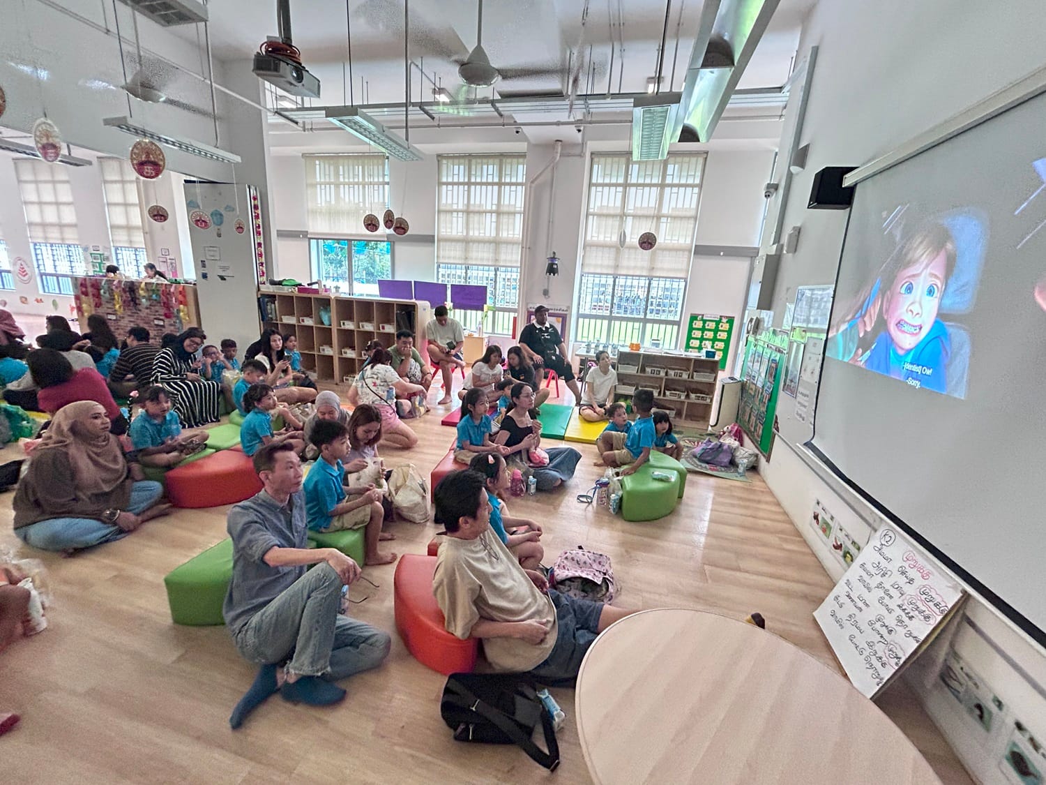 Families coming together for a joyful picnic and movie experience – Inside Out 2. With popcorns in hand, they enjoyed the movie!