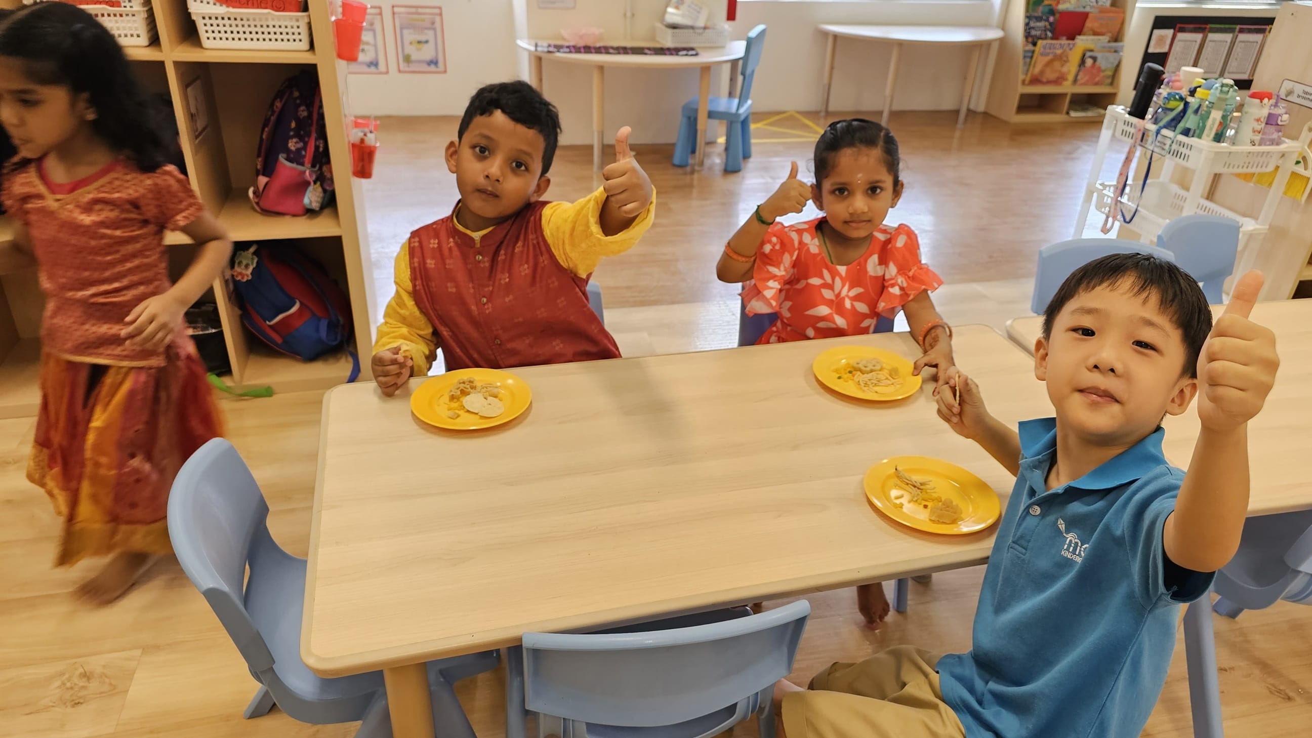 The celebration included tasting of traditional Indian snacks, where children tried new flavours and shared their favourites with friends. Teachers guided conversations about ingredients, textures, and cultural traditions around festive foods.