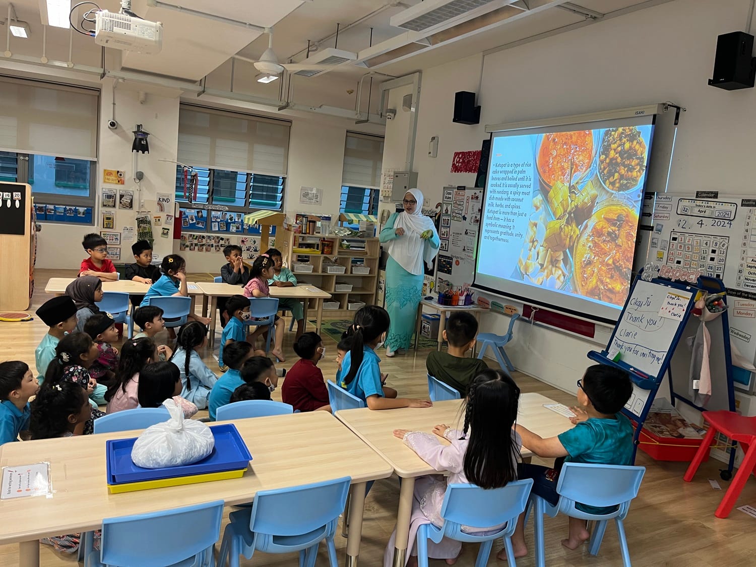 Our young learners at MK immersed themselves in the spirit of Hari Raya festivities through hands-on experiences, including crafting ketupat, guided by our parent volunteers.
