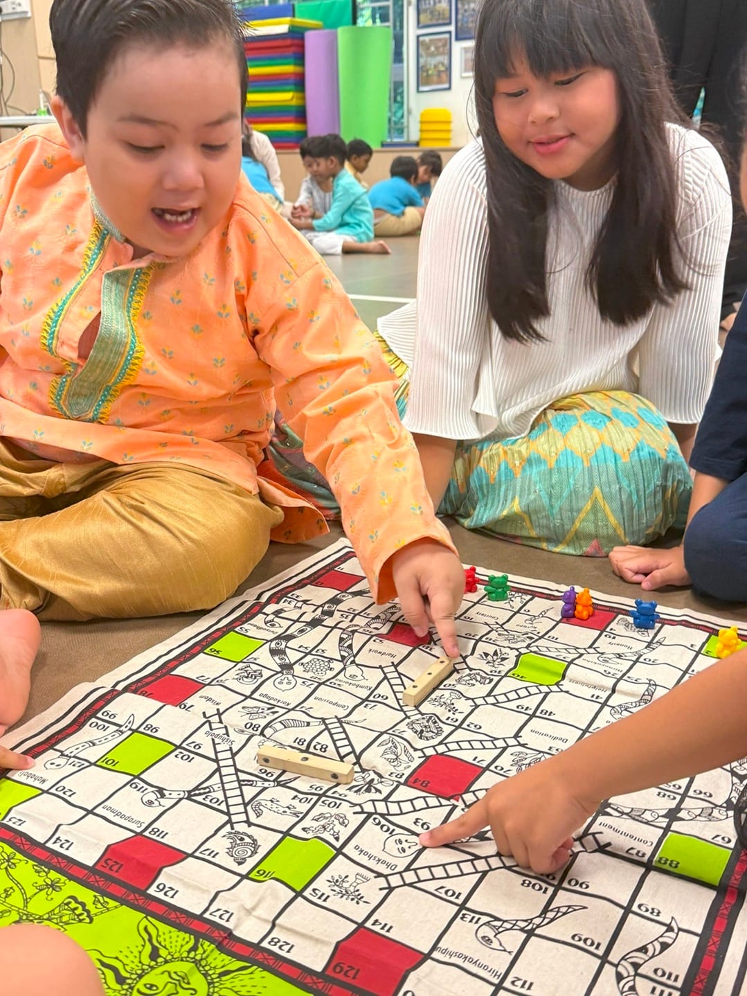 Children explored traditional Indian cultural games from spinning the top, to friendly rounds of Snake and Ladder, and lively hopscotch. These activities encouraged turn taking, coordination, and collaboration while introducing cultural play traditions in a hands on and joyful way.