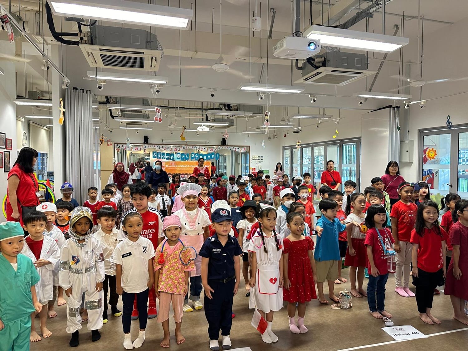 Standing at attention during the singing of our National Anthem and Pledge.