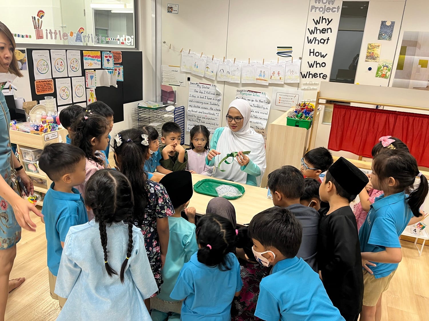 Our young learners at MK immersed themselves in the spirit of Hari Raya festivities through hands-on experiences, including crafting ketupat, guided by our parent volunteers.