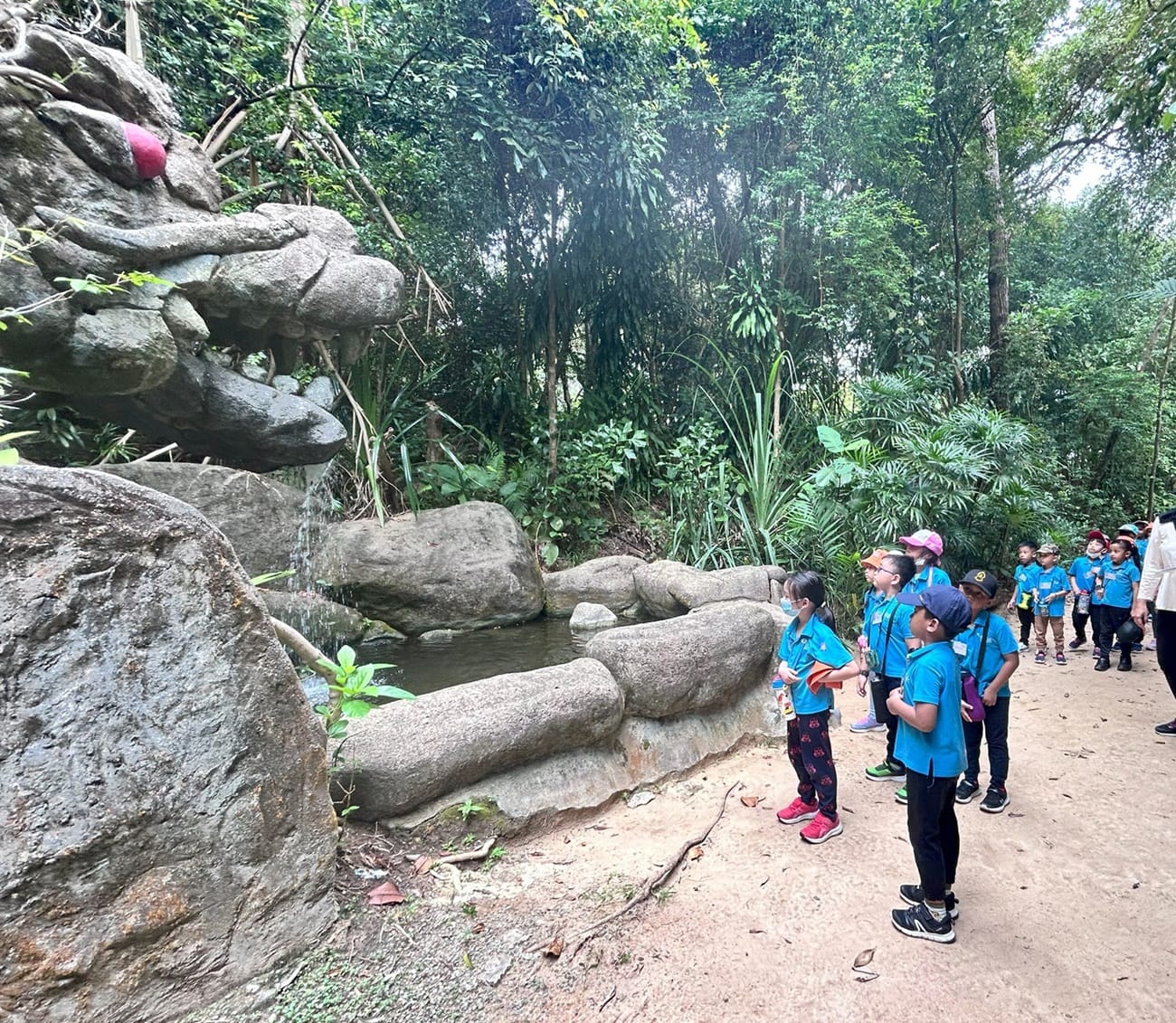 Children also observed the various sculptures along the trail such as the Rock Dragon Waterfall and the Dinosaur Skeleton. They had fun pretending to be eaten by the dinosaur!