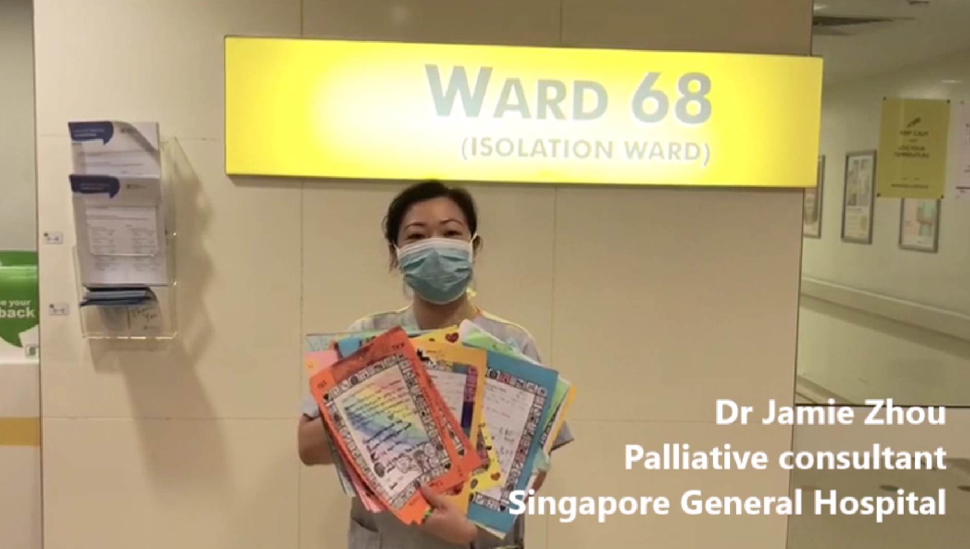Nurse holding cards from our students
