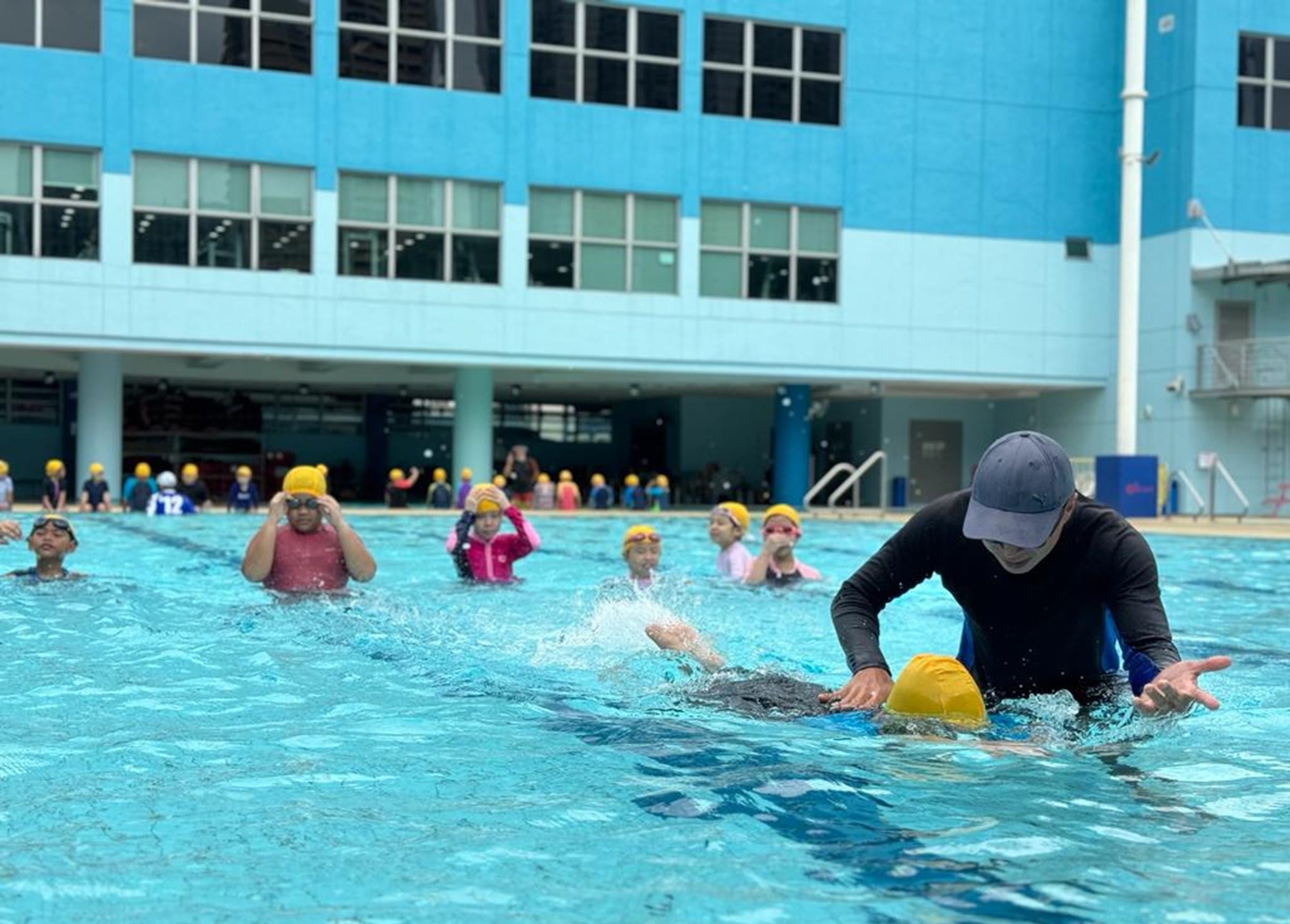 Swimming Coach with our group of students.
