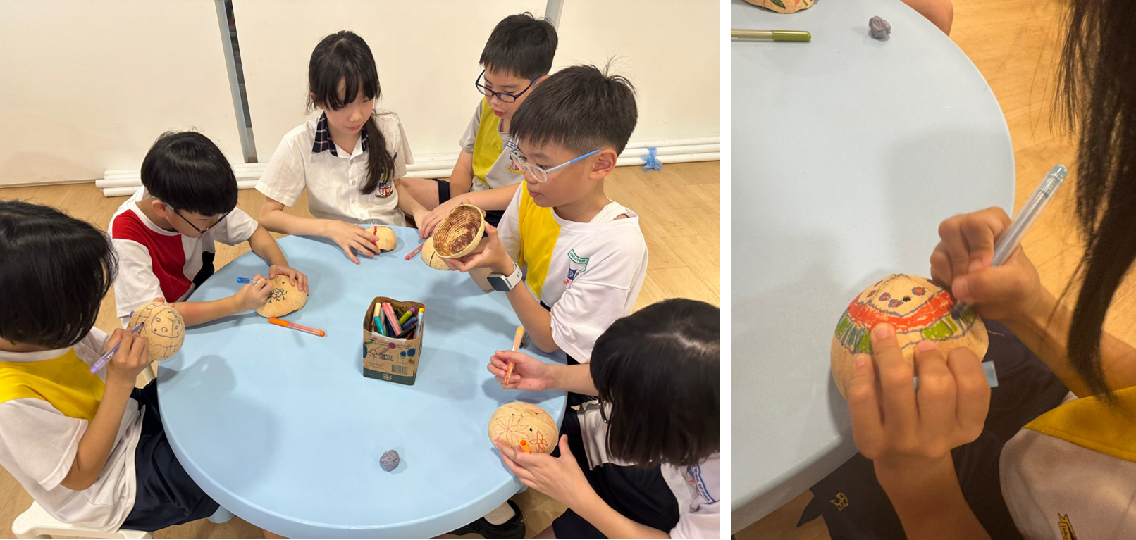 Children sit around a blue table decorating small round gourds with colorful markers during a craft activity.