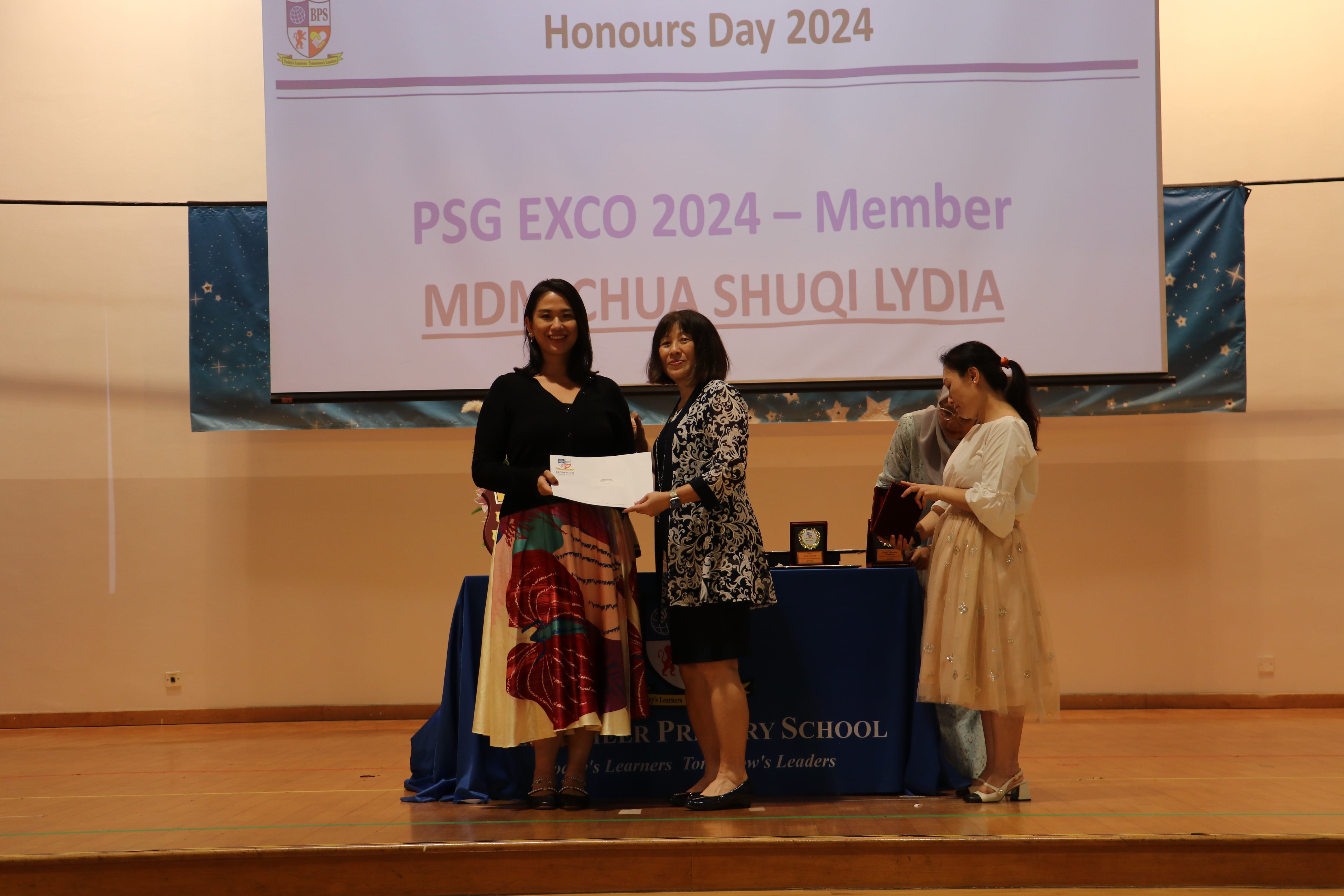 Presenting of award from Principal to PSG member