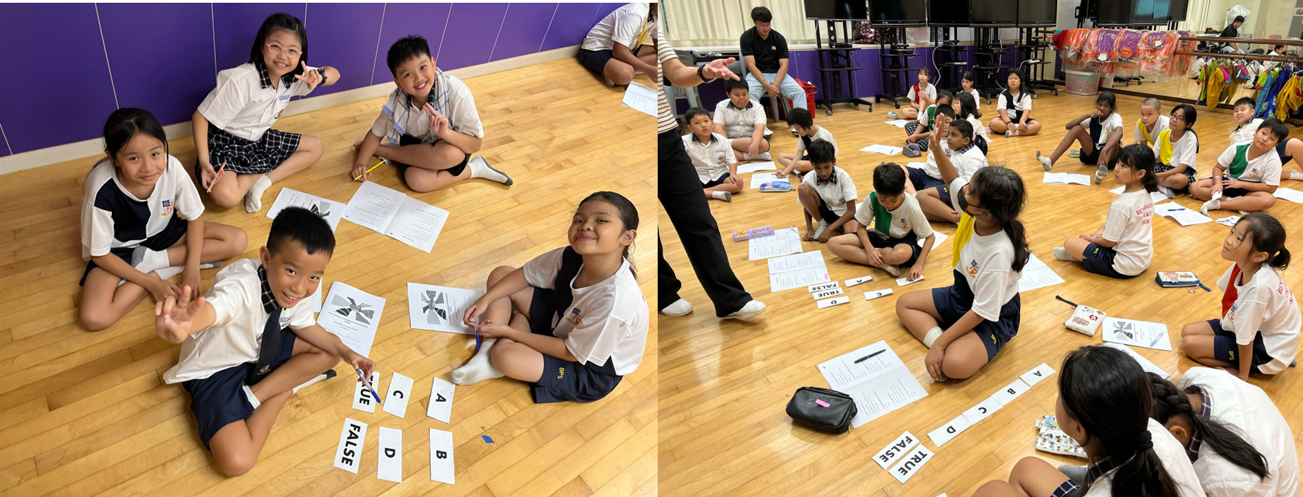 Children in school uniforms sit on a wooden floor doing a group activity with true/false and letter cards.