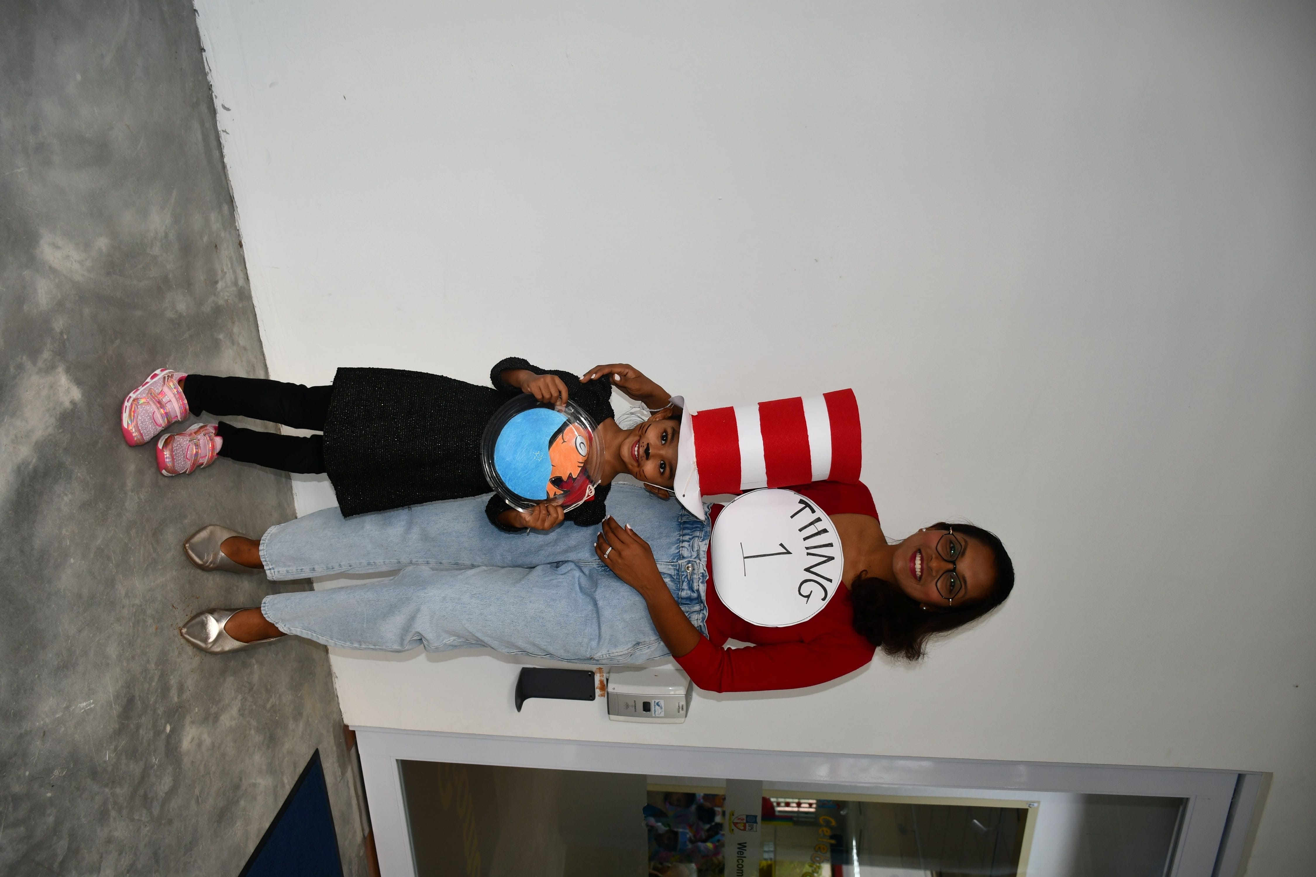 Parent and student posing with their costume.