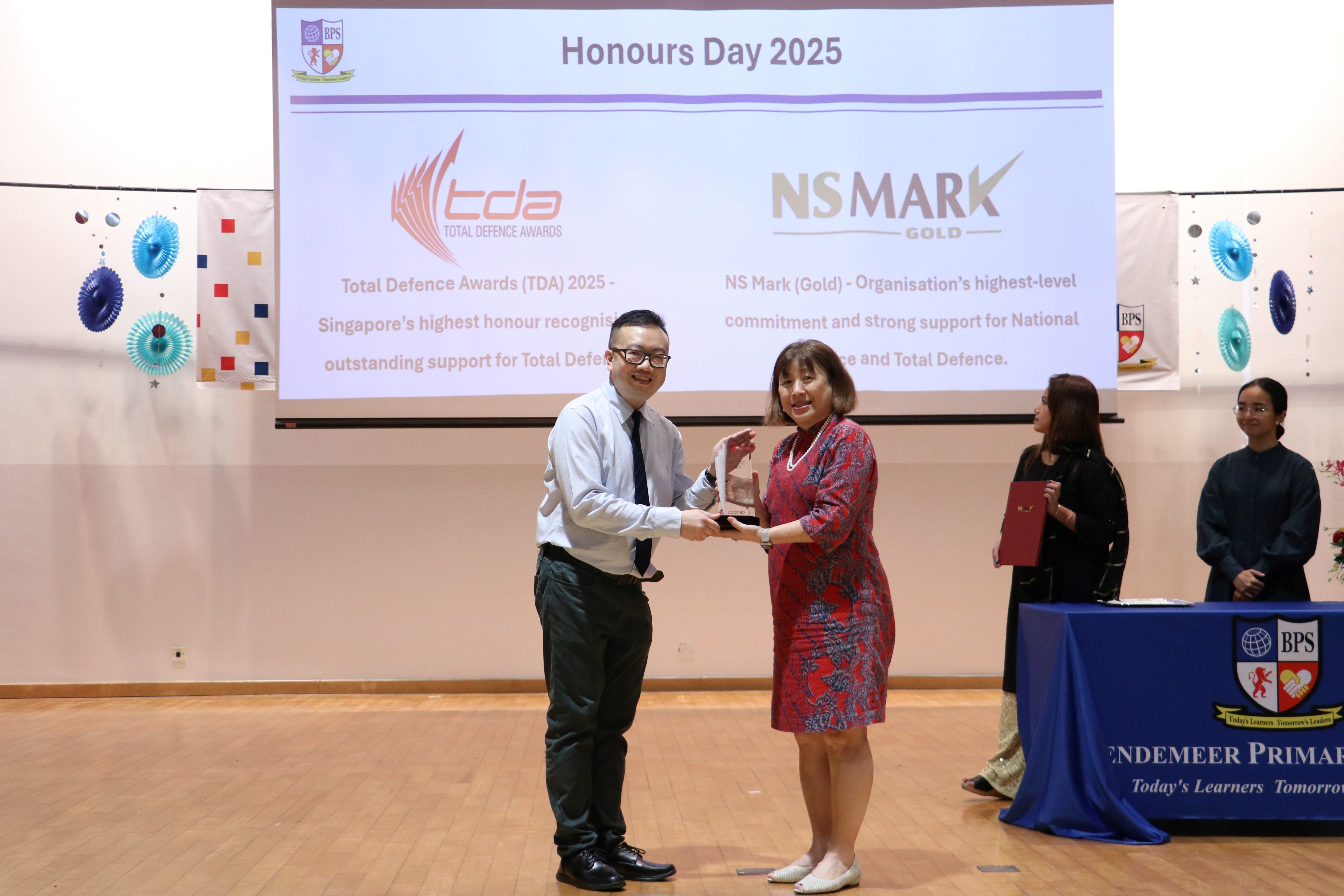 Presenting the TDA award to Principal on stage