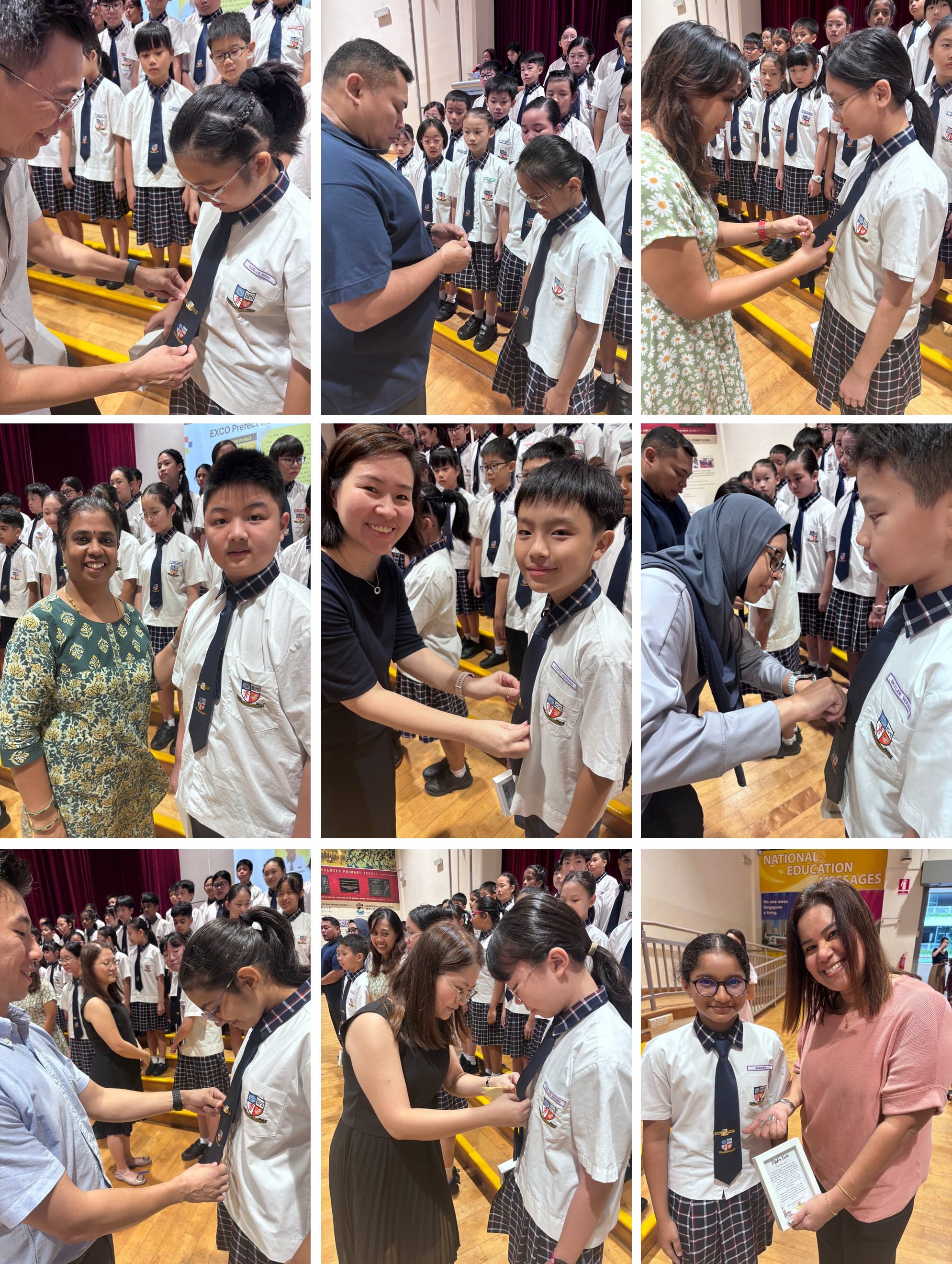 Teachers pinning badges onto uniformed school students during a prefect investiture ceremony in a school hall.