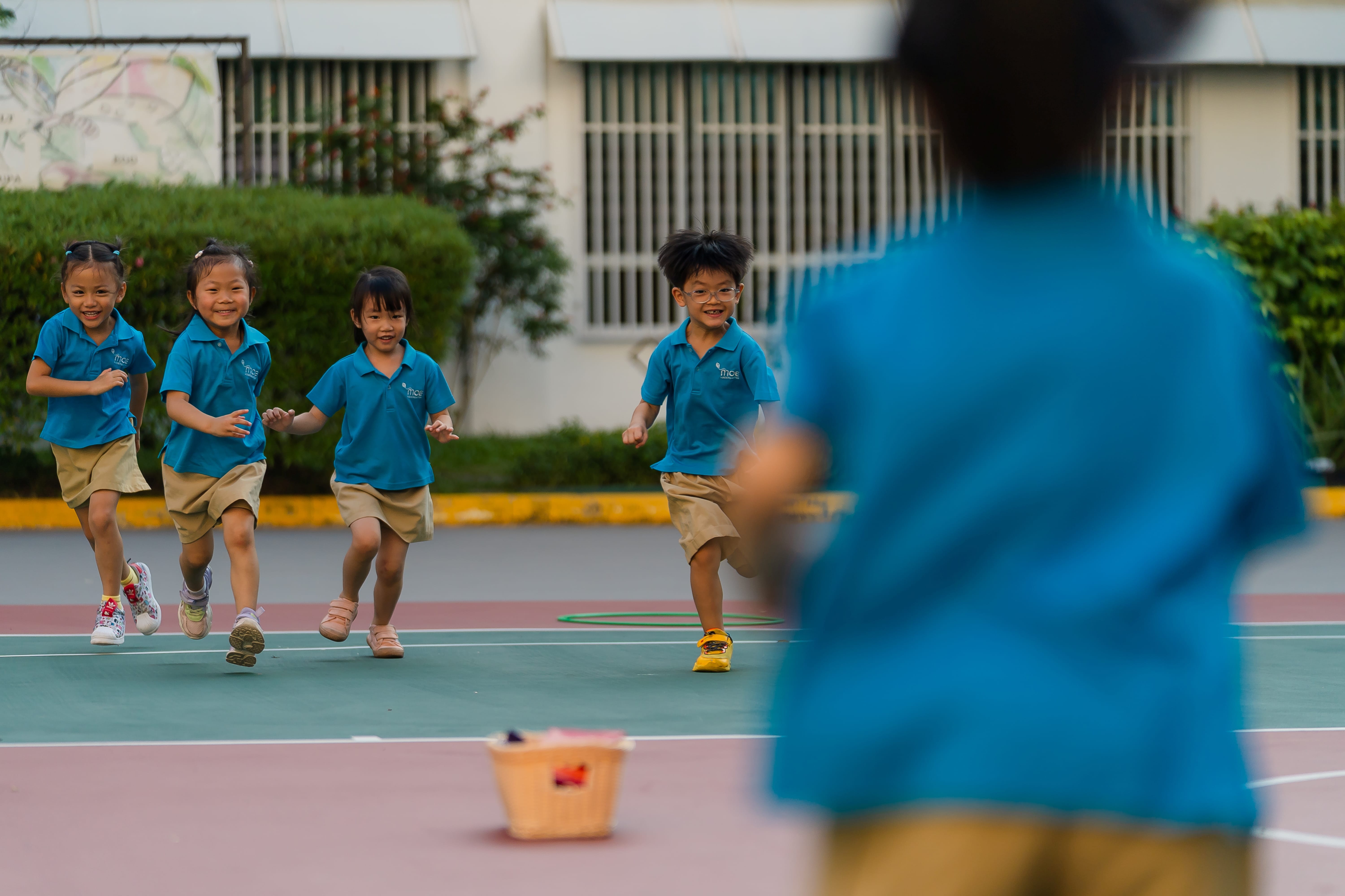 Children playing at the basketball court