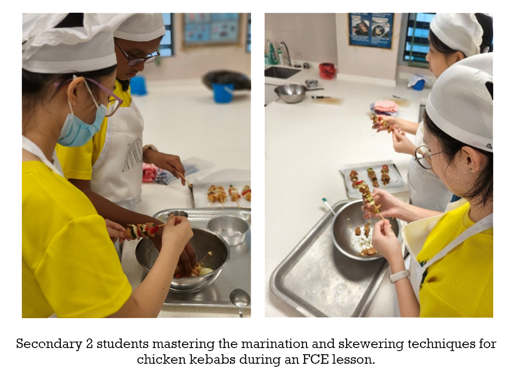 Students in white chef hats and yellow shirts assemble chicken kebabs on skewers during a cooking class.