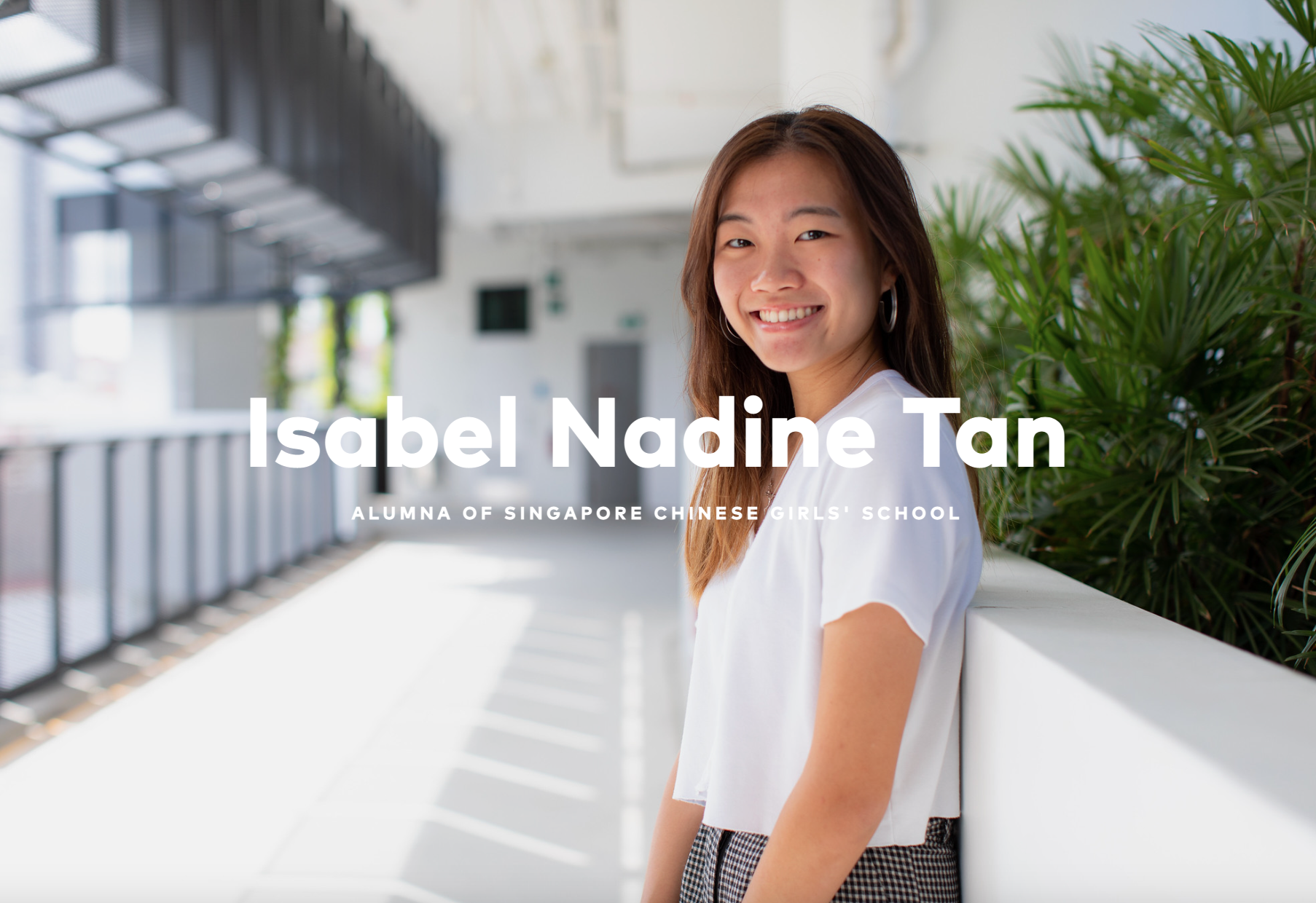 Isabel Nadine Tan, alumna of Singapore Chinese Girls' School, smiling in a white top outdoors.
