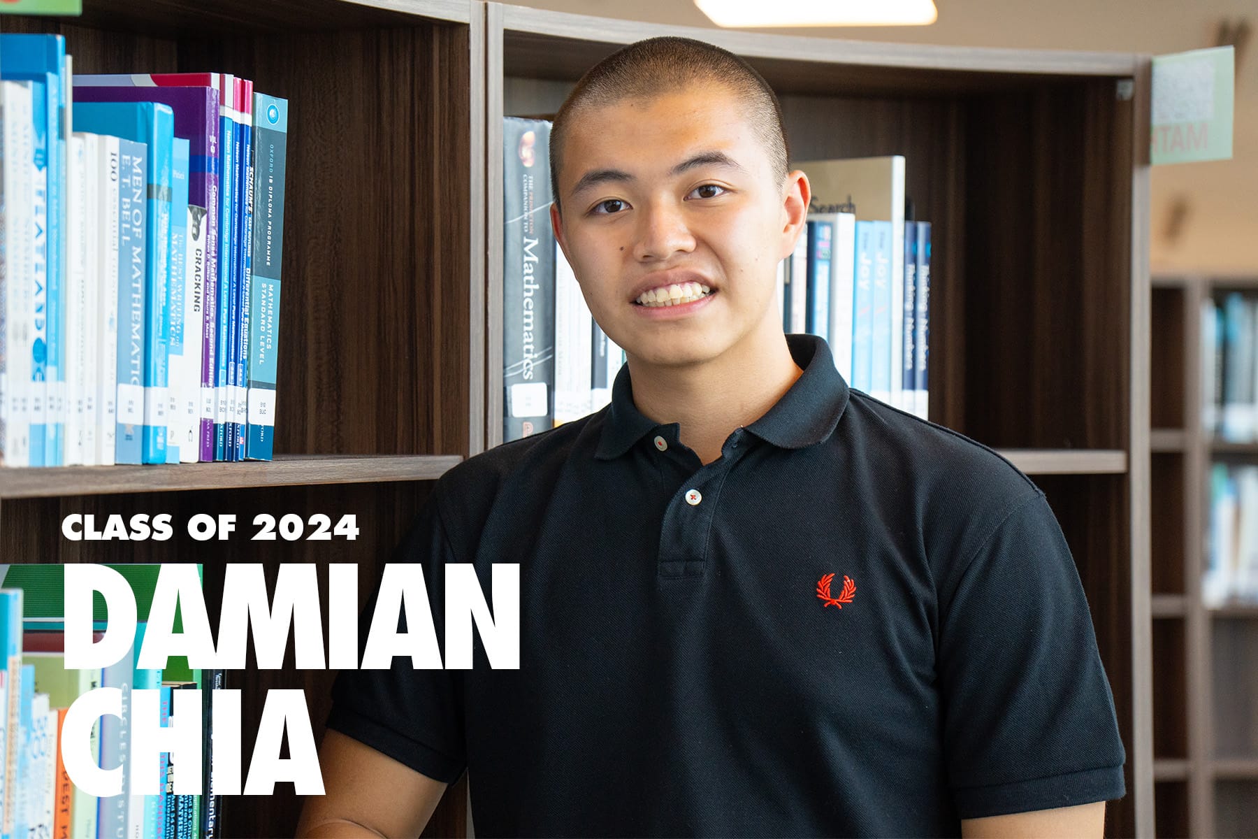 Smiling young man named Damian Chia, Class of 2024, standing in front of bookshelves in a library.