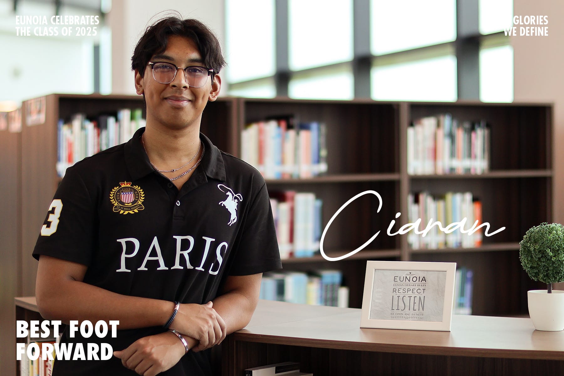 Young man named Cianan in a black Paris polo shirt smiling in a library for Eunoia Class of 2025.