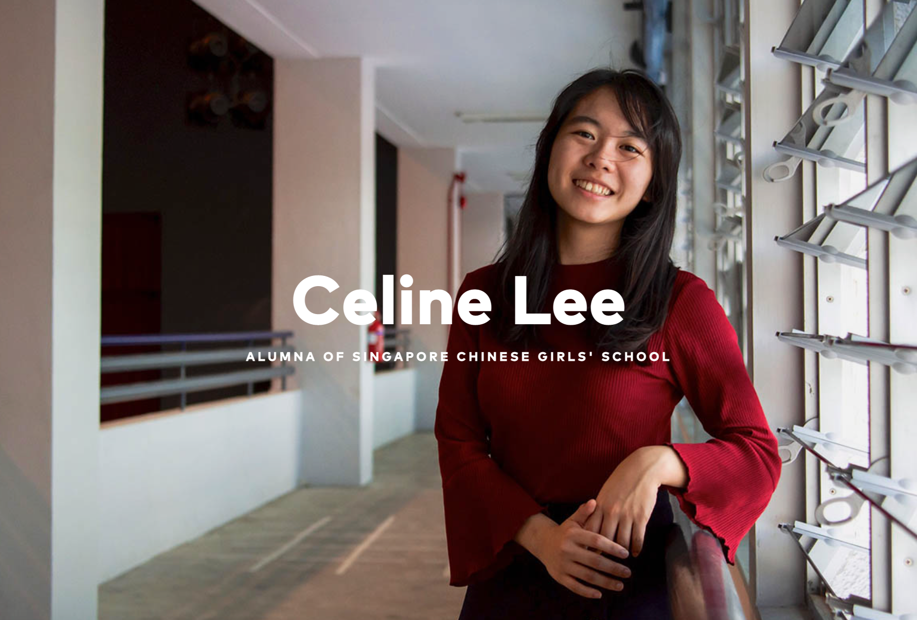 Celine Lee, alumna of Singapore Chinese Girls' School, smiling in a red top in a school corridor.
