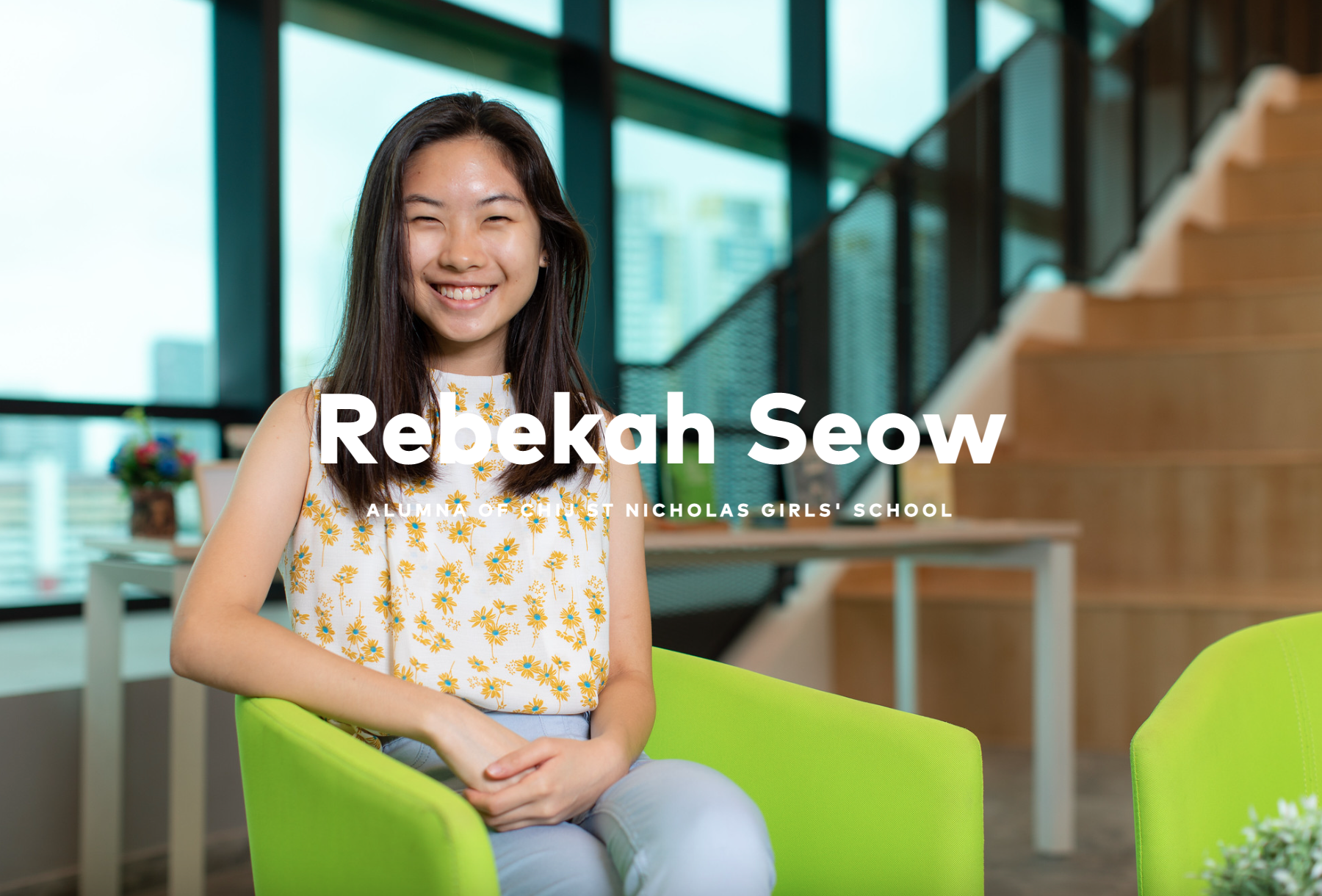 Rebekah Seow, alumna of CHIJ St Nicholas Girls' School, smiling and seated on a green chair indoors.