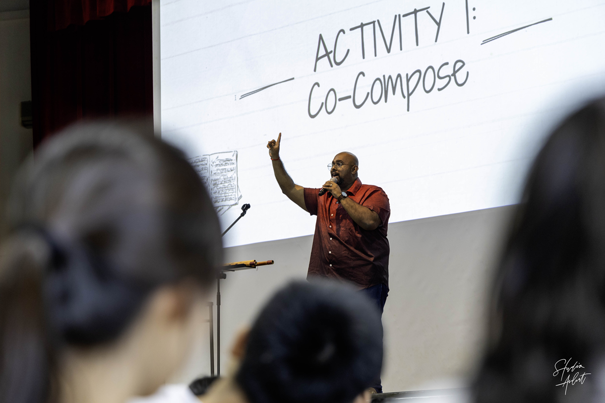 Guest speaker Niranjan Pandian guiding C2 students through the interactive co-composition activity.