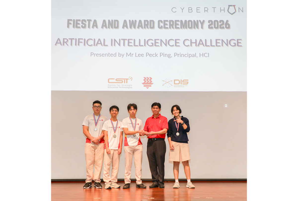3rd place team members receiving their medal on stage.