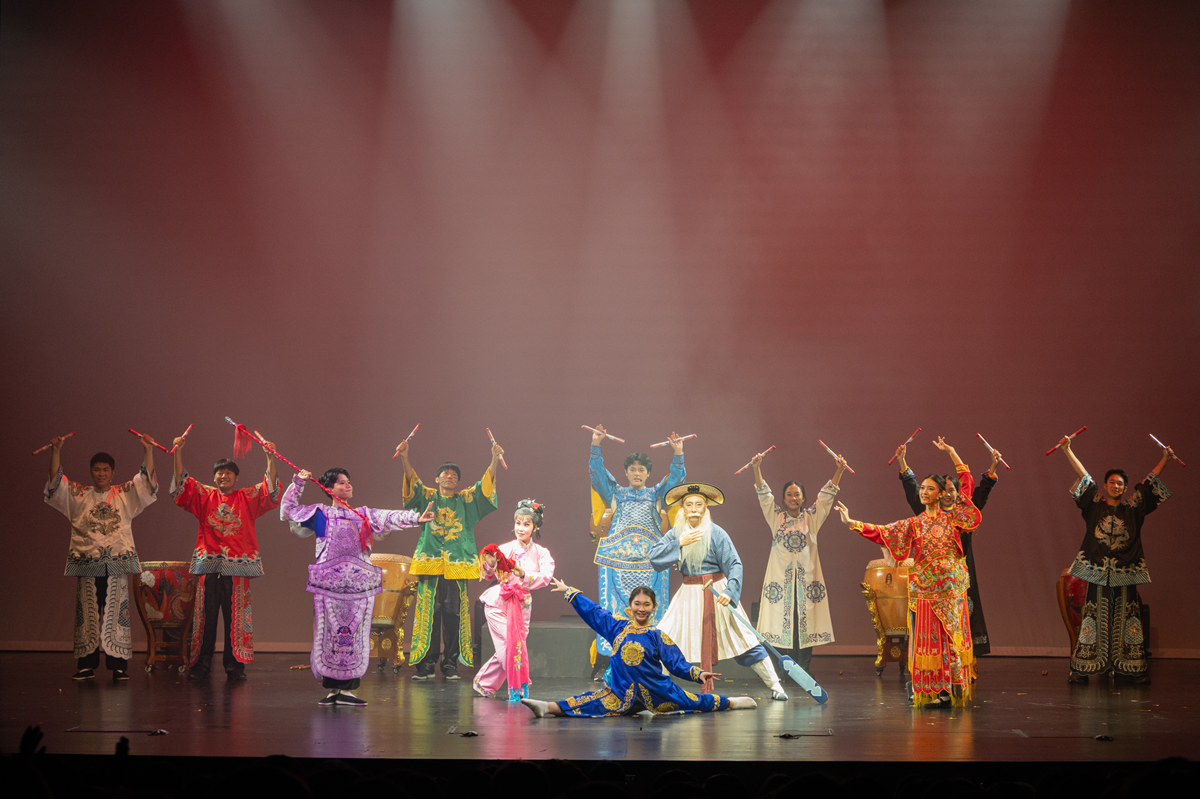A tradition scene with full performance on stage.
