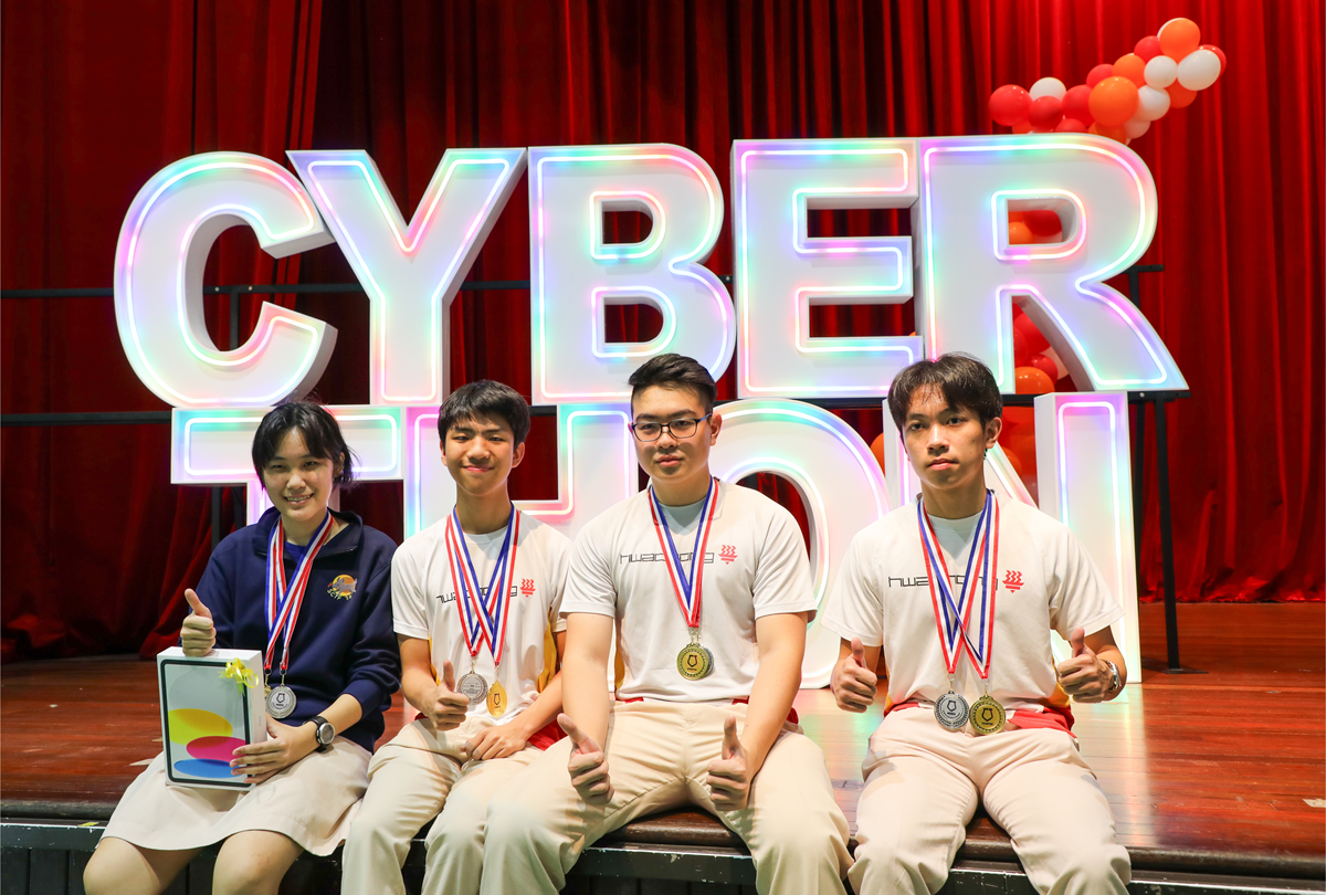 1st prize winner team member taking photo together on stage.