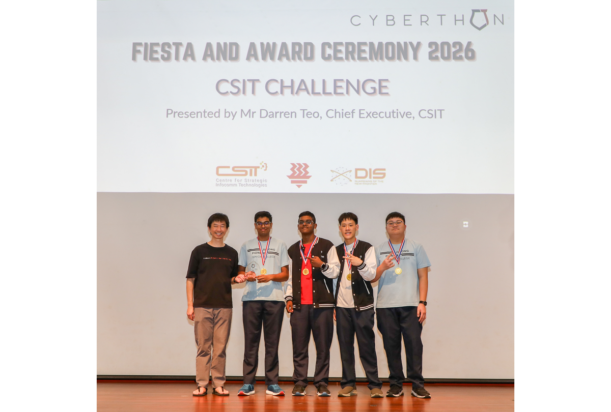 2nd place team members receiving their medal on stage.