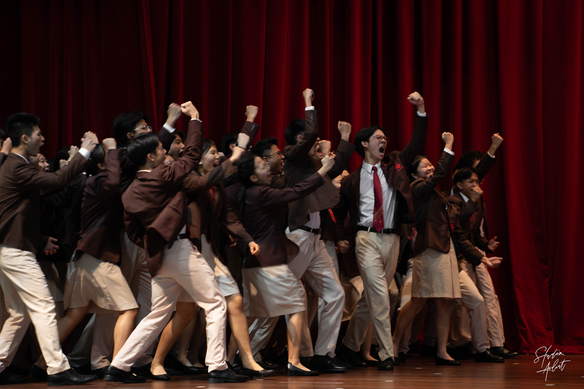 both batches cheering on stage