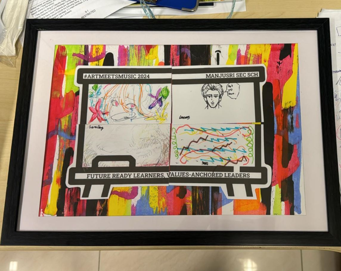 A colourfu display board featuring students' drawings and artwork showcased in a decorative frame.