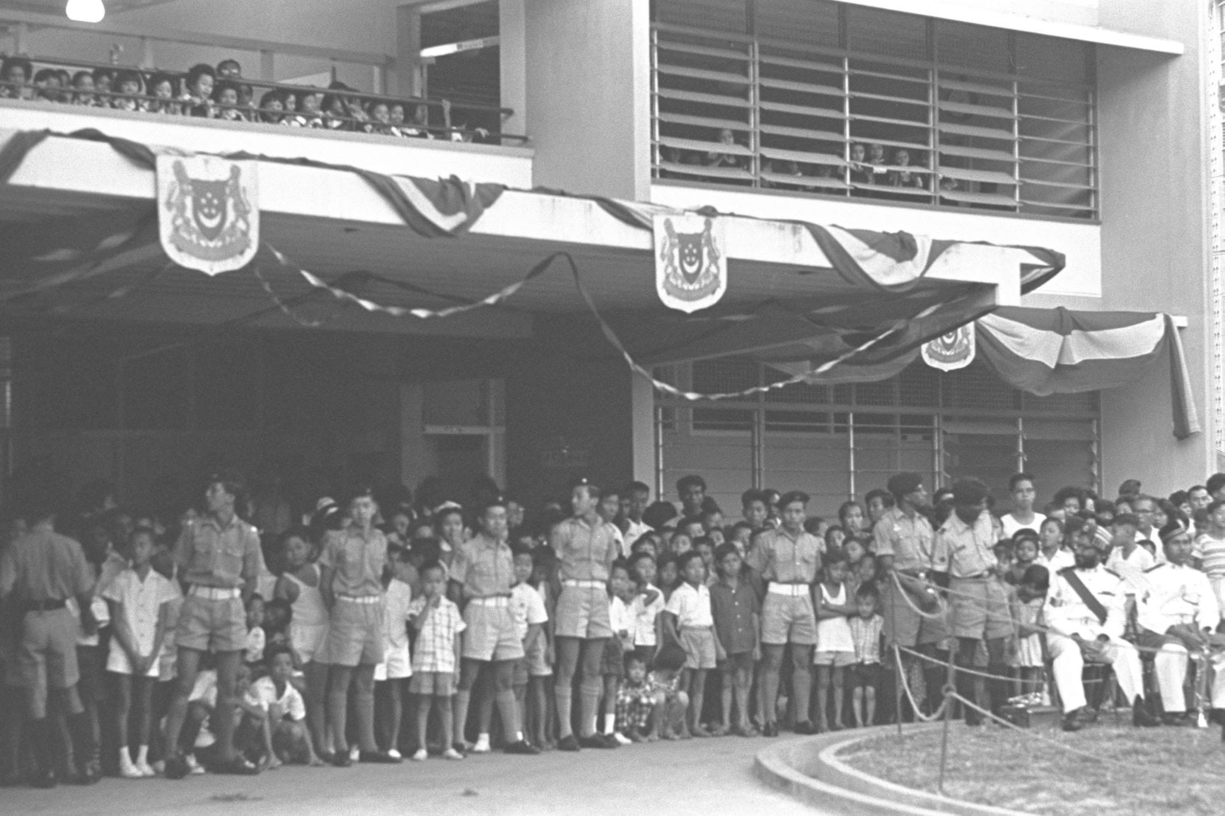 School children awaiting the arrival of Deputy Prime Minister Dr Toh Chin Chye for the opening of Selegie Primary School (1963). Ministry of Information and the Arts Collection, courtesy of National Archives of Singapore.