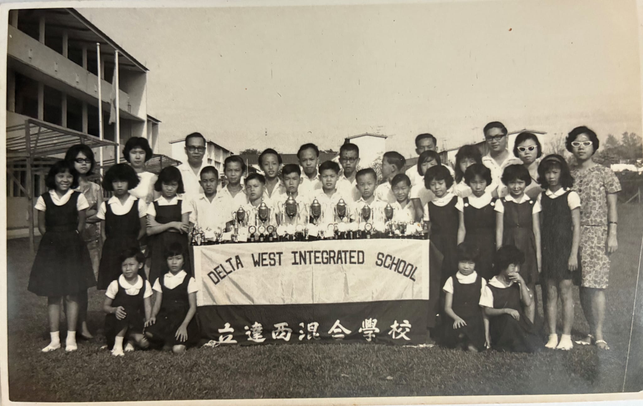 Photo of school Track and Field Team with Principal and teachers-in-charge taken in 1966. Courtesy of Ms C C Tan