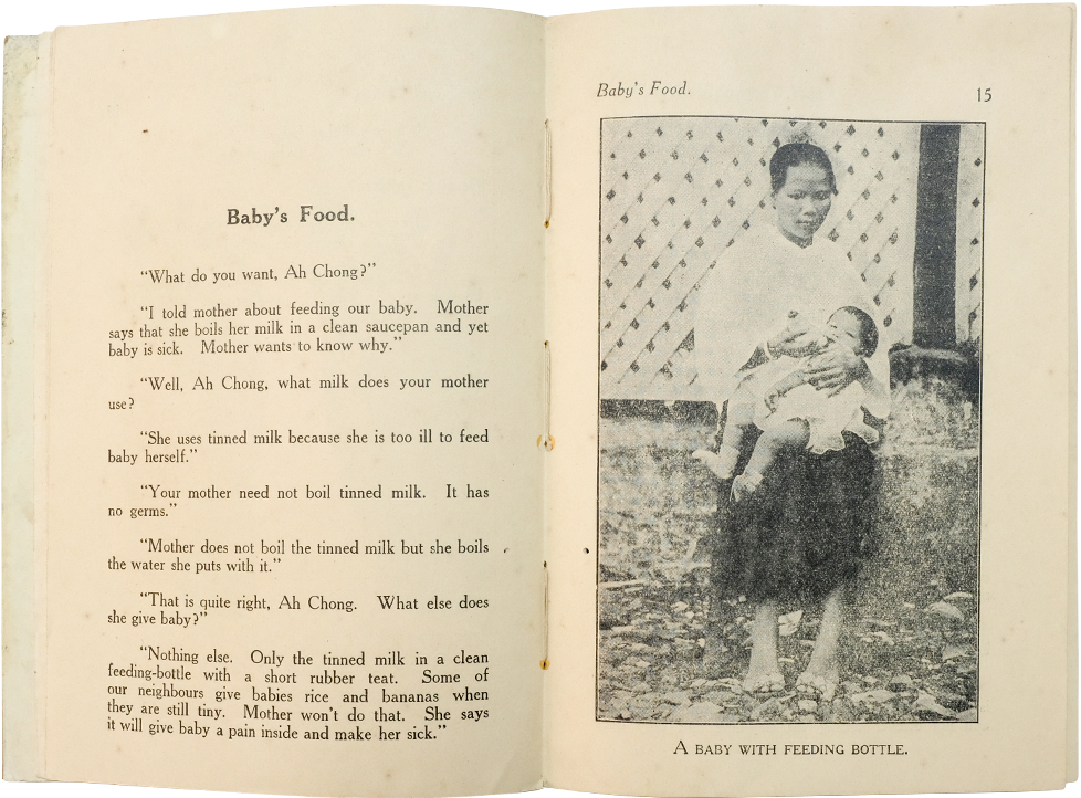 Open book showing page 15 titled Baby's Food with text and a black-and-white photo of a woman holding a baby with a feeding bottle.