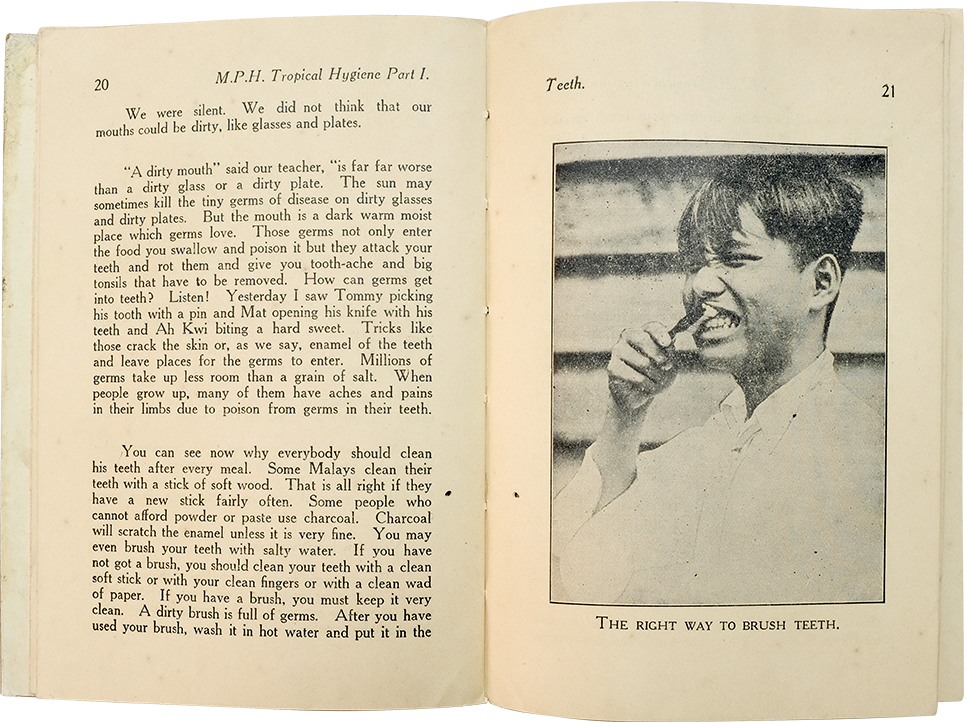 Open book showing pages 20-21 of M.P.H. Tropical Hygiene, with text on teeth and a photo of a boy brushing his teeth.