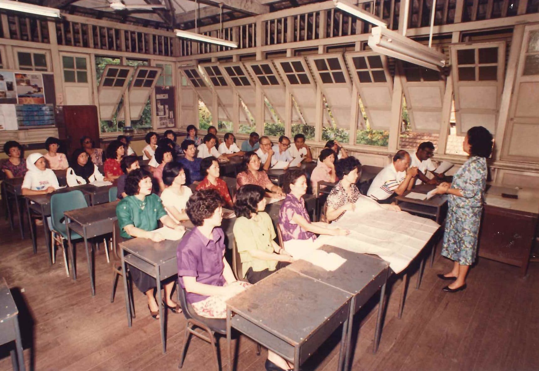 Staff meeting, chaired by the school principal (1993).
