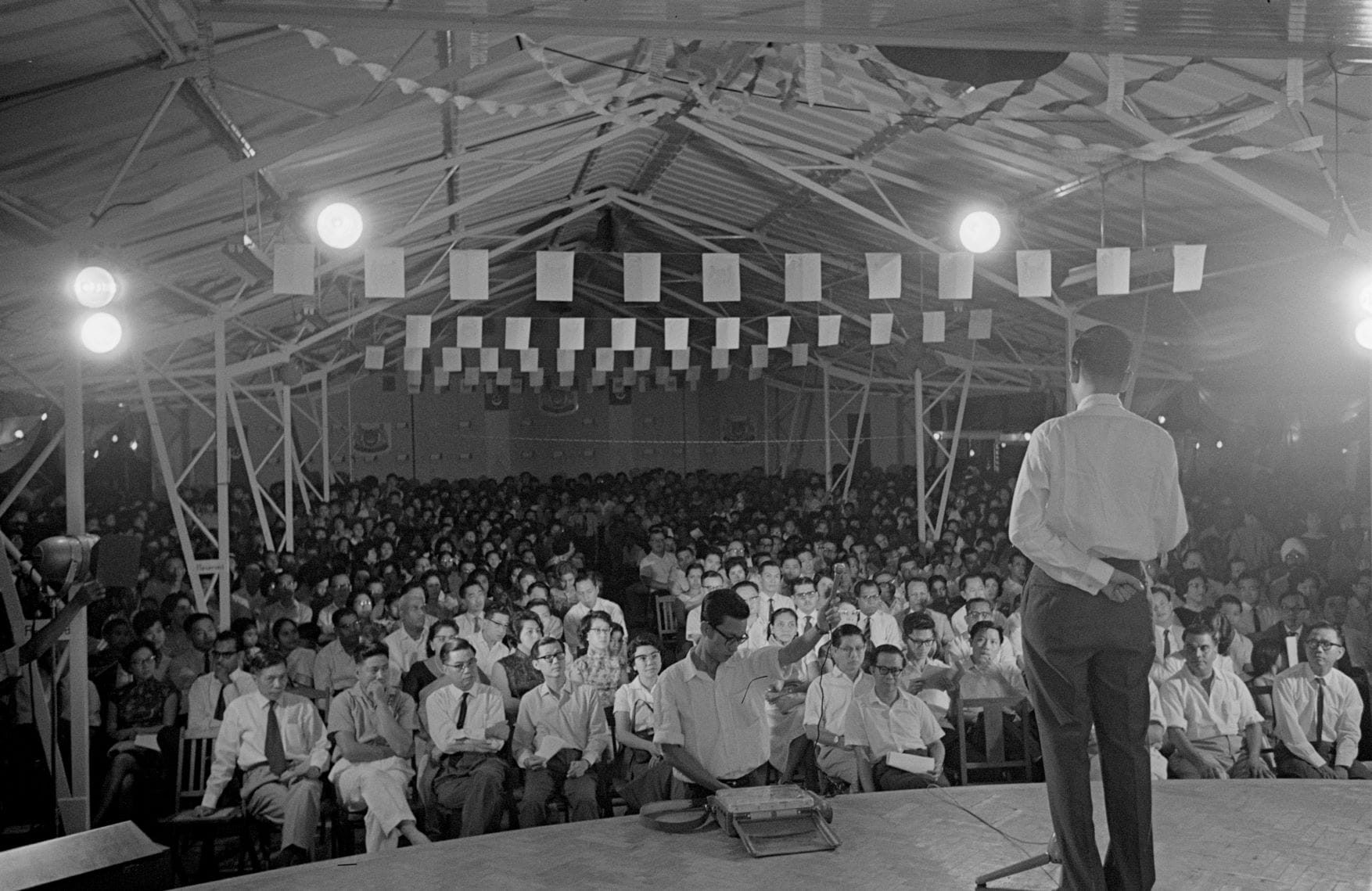 School officials delivering a speech during the opening of Selegie Primary School (1963). Ministry of Information and the Arts Collection, courtesy of National Archives of Singapore.
