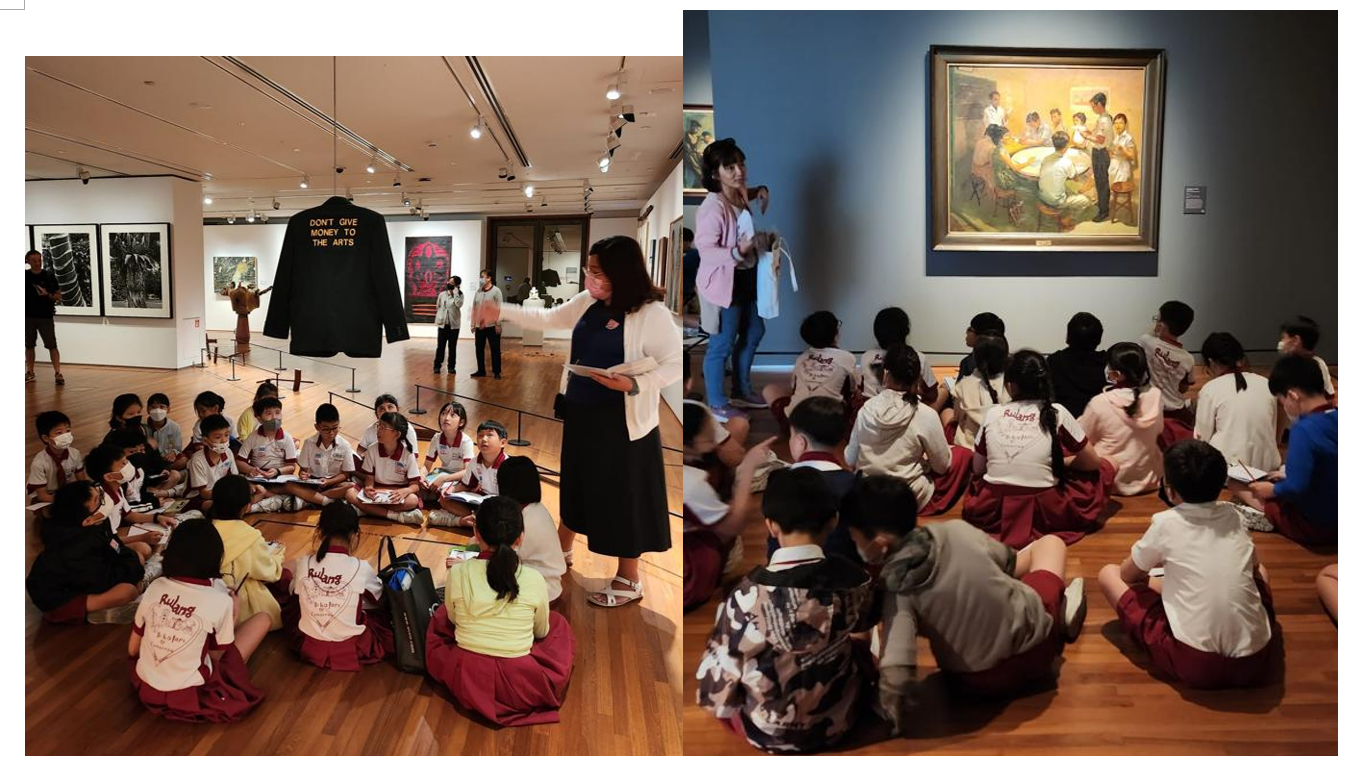 Students in uniforms sit on museum floors listening to guides near artwork, including a jacket and a painting.